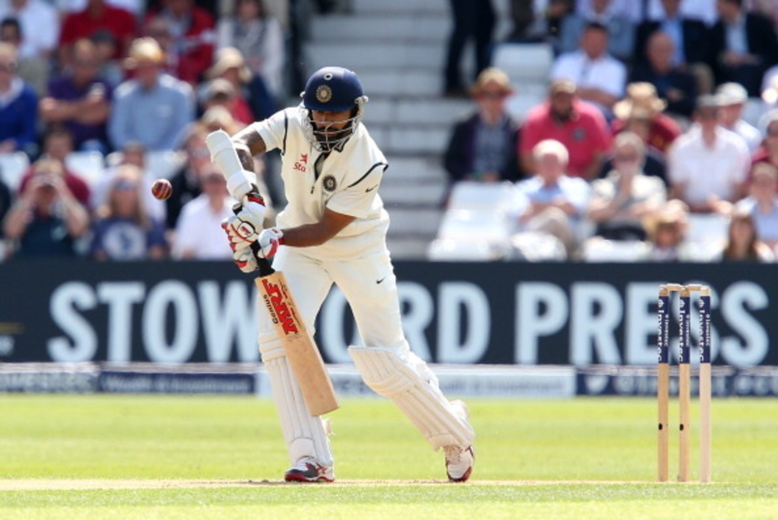 NOTTINGHAM, ENGLAND - JULY 09: Shikhar Dhawan of India plays defensive during day one of the 1st Investec Test between England and India at Trent Bridge on July 9, 2014 in Nottingham, England.  (Photo by Jan Kruger/Getty Images)