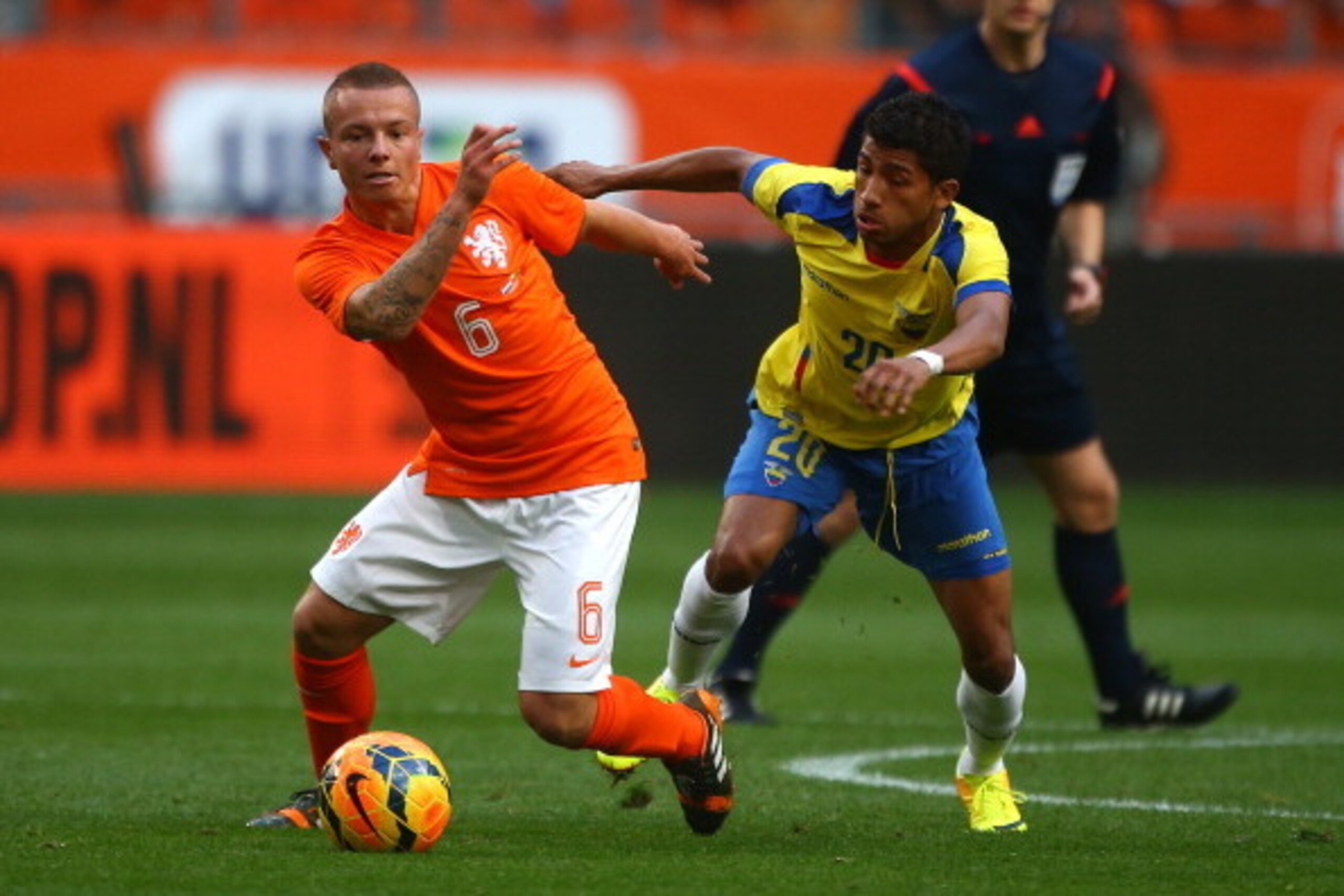 AMSTERDAM, NETHERLANDS - MAY 17: Jordy Clasie of Holland looks to hold of Ecuador's Joao Rojas during the International Friendly match between The Netherlands and Ecuador at The Amsterdam Arena on May 17, 2014 in Amsterdam, Netherlands. (Photo by Charlie 