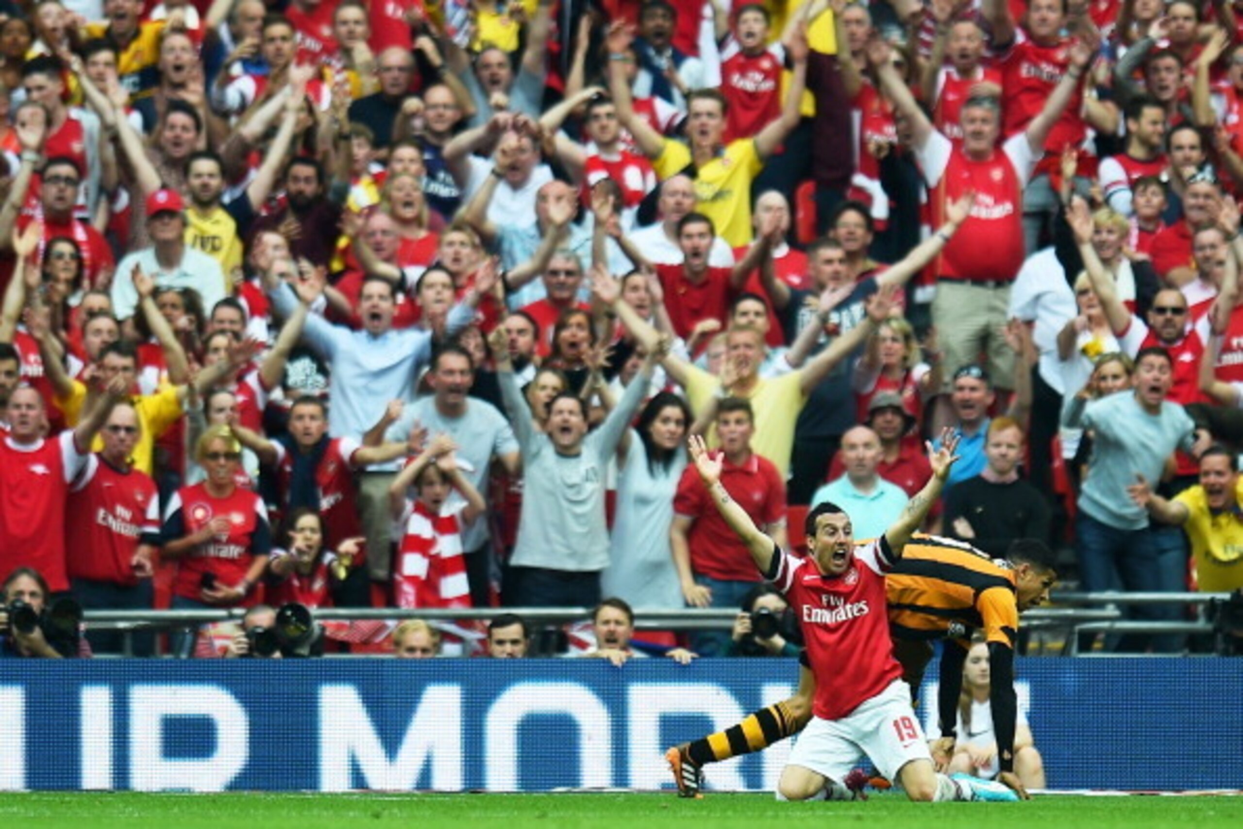 LONDON, ENGLAND - MAY 17:  Santi Cazorla of Arsenal and Arsenal fans appeal during the FA Cup with Budweiser Final match between Arsenal and Hull City at Wembley Stadium on May 17, 2014 in London, England.  (Photo by Shaun Botterill/Getty Images)