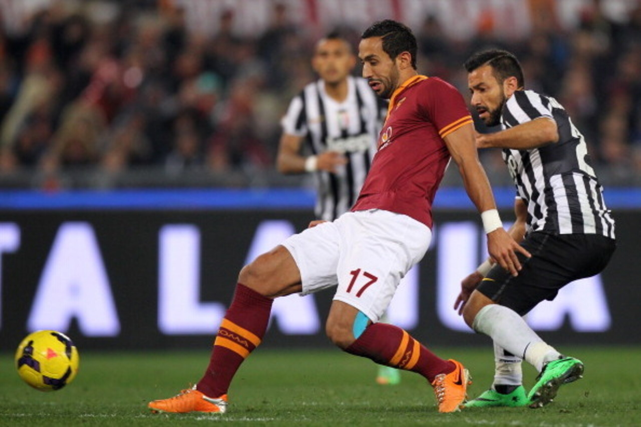 ROME, ITALY - JANUARY 21:  Fabio Quagliarella (R) of Juventus FC competes for the ball with Mehdi Benatia of AS Roma during the TIM Cup match between AS Roma and Juventus FC at Olimpico Stadium on January 21, 2014 in Rome, Italy.  (Photo by Paolo Bruno/Ge