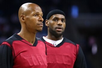 CHARLOTTE, NC - APRIL 28:  Ray Allen #34 of the Miami Heat and teammate LeBron James #6 wear a black head band and inside out warm up jersey before their game against the Charlotte Bobcats in Game Four of the Eastern Conference Quarterfinals during the 20