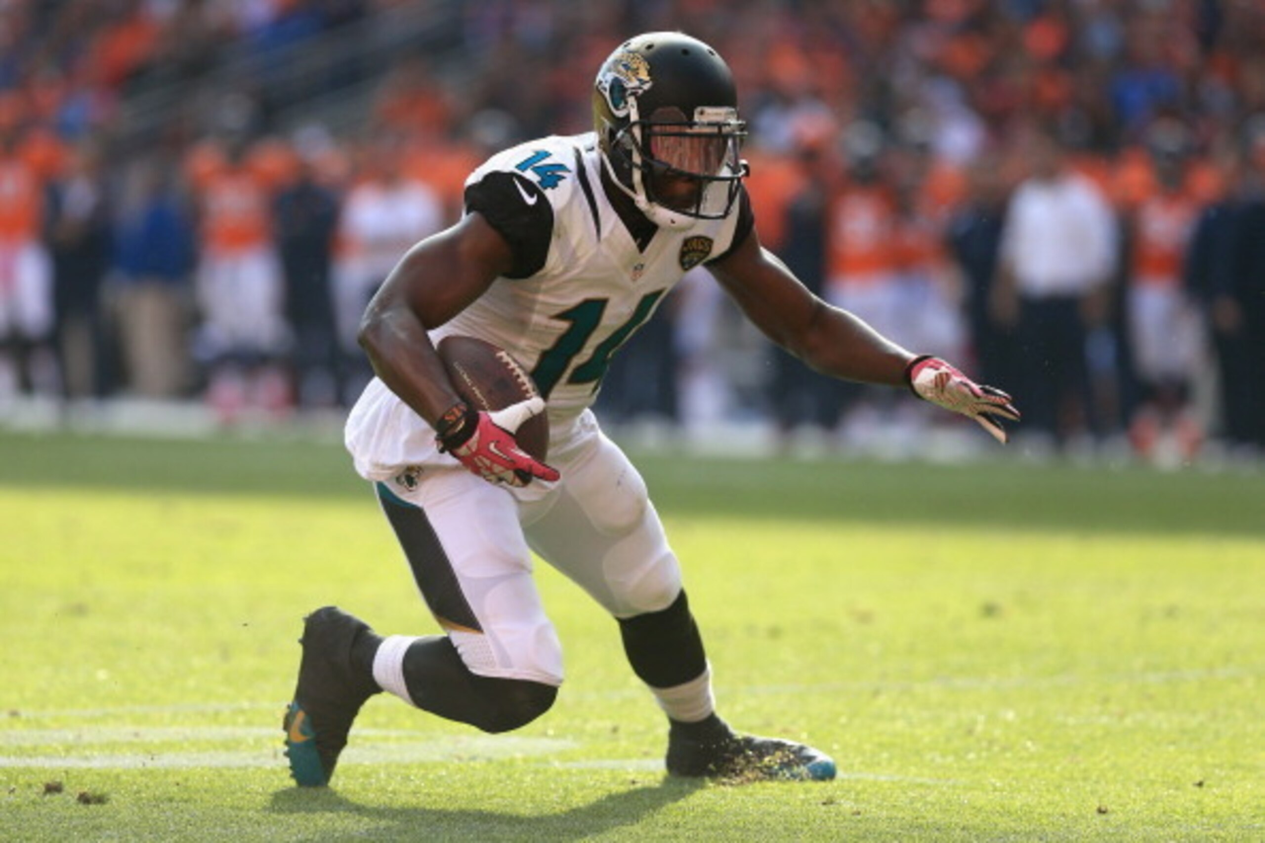 DENVER, CO - OCTOBER 13:  Wide receiver Justin Blackmon #14 of the Jacksonville Jaguars makes a pass reception against the Denver Broncos at Sports Authority Field at Mile High on October 13, 2013 in Denver, Colorado. The Broncos defeated the Jaguars 35-1