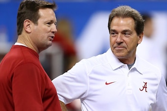 NEW ORLEANS, LA - JANUARY 02:  Head coach Bob Stoops of Oklahoma Sooners talks with Nick Saban head coach of the Alabama Crimson Tide prior to the Allstate Sugar Bowl at the Mercedes-Benz Superdome on January 2, 2014 in New Orleans, Louisiana.  (Photo by