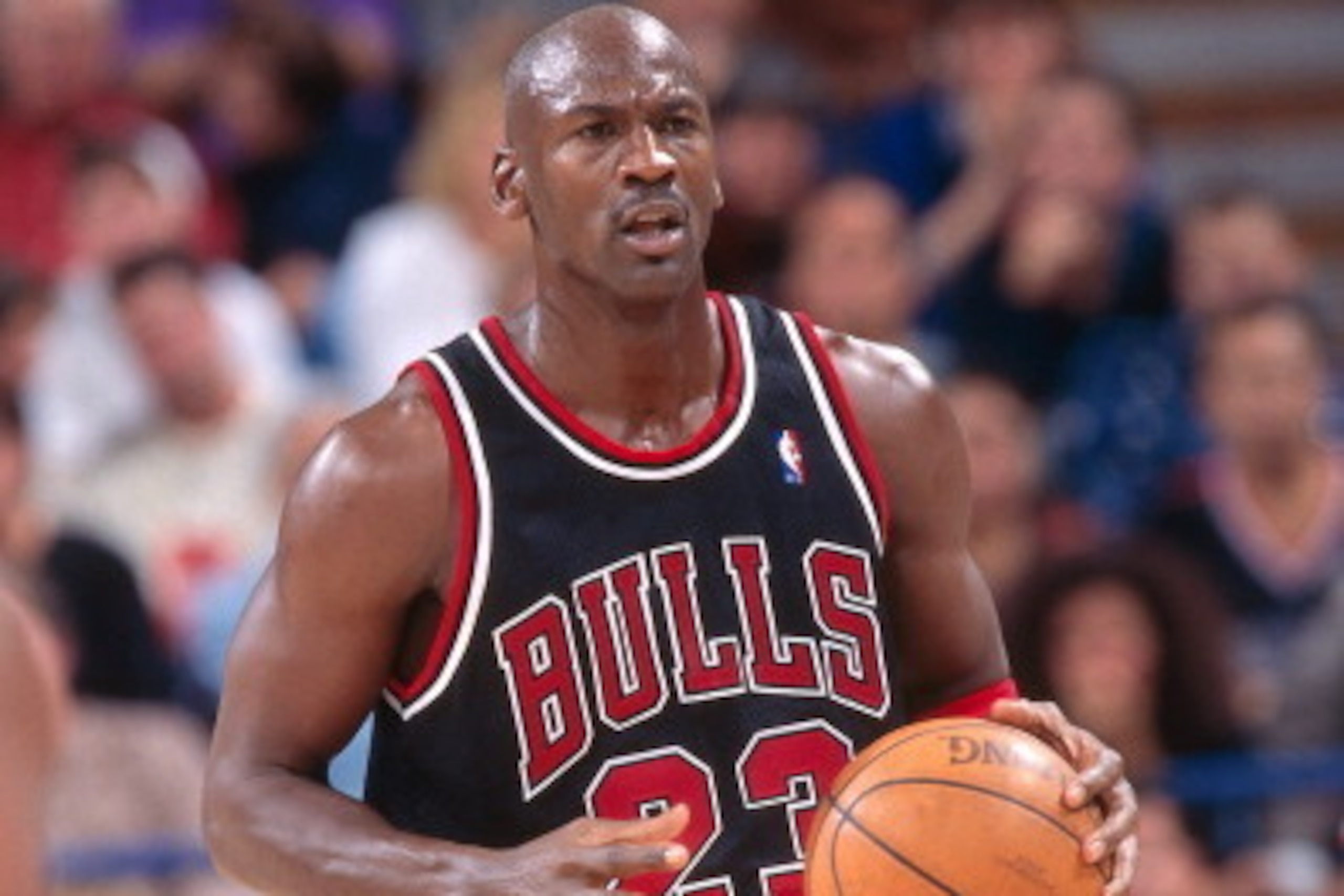 SACRAMENTO, CA - NOVEMBER 23: Michael Jordan #23 of the Chicago Bulls dribbles the ball against the Sacramento Kings on November 23, 1997 at Arco Arena in Sacramento, California. NOTE TO USER: User expressly acknowledges and agrees that, by downloading an