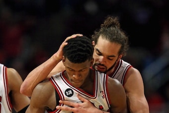 CHICAGO, IL - APRIL 22: Joakim Noah #13 of the Chicago Bulls hugs teammate Jimmy Butler during Game Two of the Eastern Conference Quarterfinals during the 2014 NBA Playoffs against the Washington Wizards at the United Center on April 22, 2014 in Chicago, 