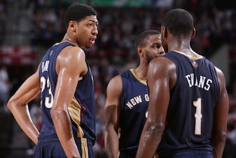 PORTLAND, OR - APRIL 6:  Anthony Davis #23 and Tyreke Evans #1 of the New Orleans Pelicans huddle up during the game against the Portland Trail Blazers on April 6, 2014 at the Moda Center Arena in Portland, Oregon. NOTE TO USER: User expressly acknowledge