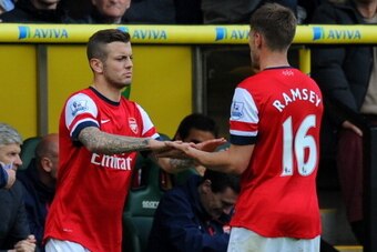 NORWICH, ENGLAND - MAY 11: Jack Wilshere of Arsenal replaces Aaron Ramsey of Arsenal during the Barclays Premier League match between Norwich City and Arsenal at Carrow Road on May 11, 2014 in Norwich, England.  (Photo by Steve Bardens/Getty Images)