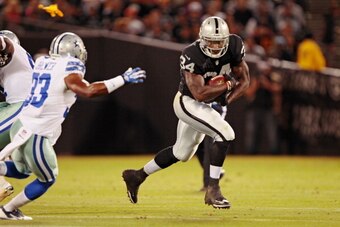OAKLAND, CA - AUGUST 9:  Running back Latavius Murray #34 of the Oakland Raiders heads to the outside against the Dallas Cowboys in the fourth quarter of a preseason game on August 9, 2013 at O.co Coliseum in Oakland, California.  The Raiders won 19-17.  