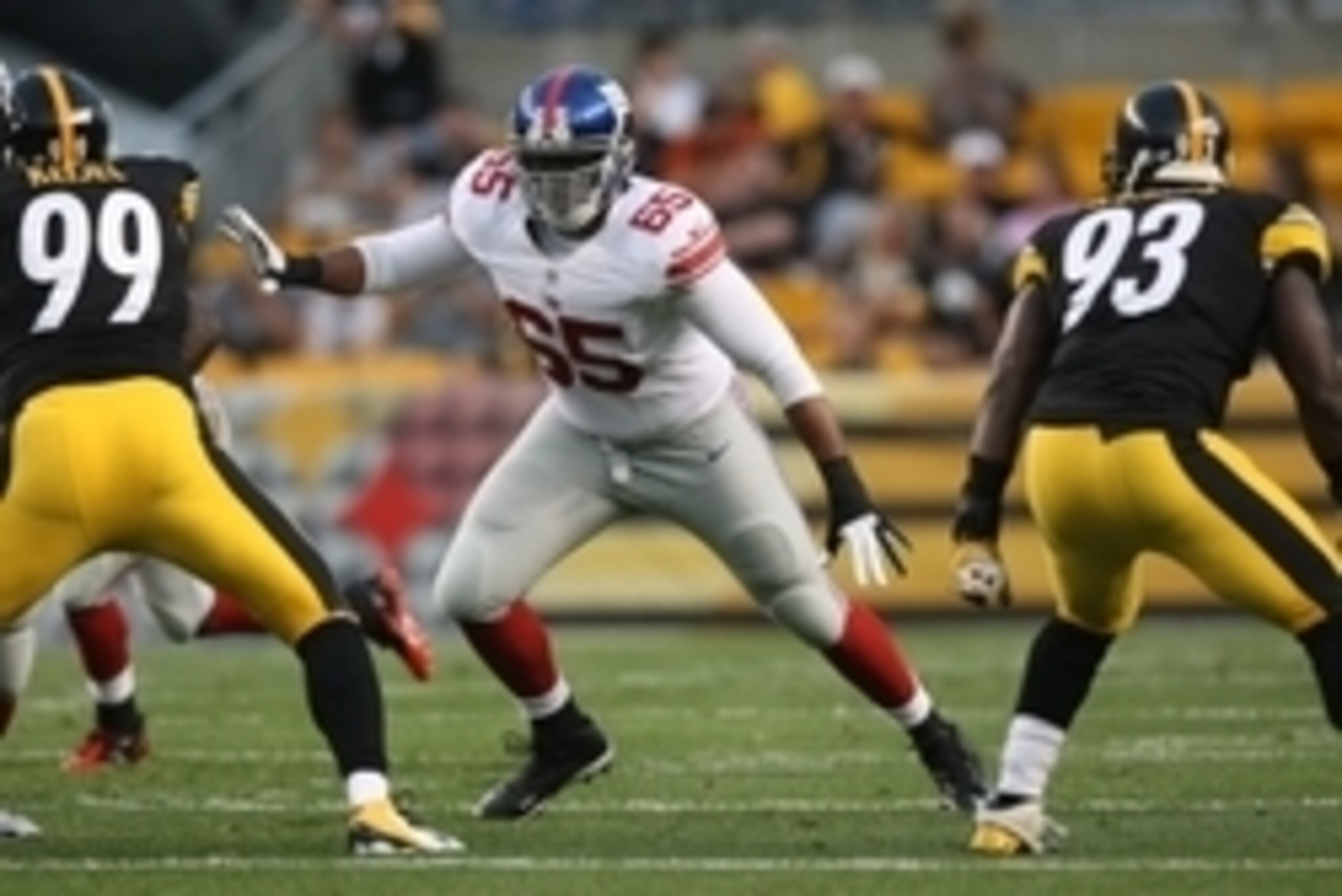 Aug 10, 2013; Pittsburgh, PA, USA; New York Giants tackle Will Beatty (65) blocks against the Pittsburgh Steelers during the first half at Heinz Field. Mandatory Credit: Jason Bridge-USA TODAY Sports