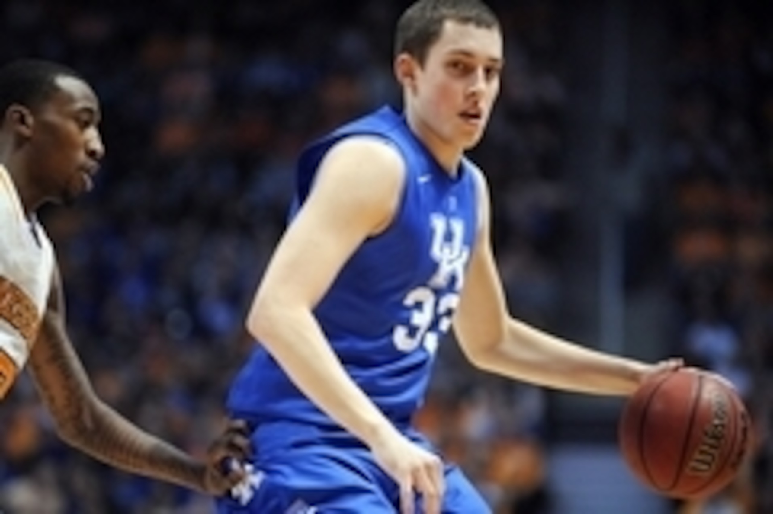 Mar 16, 2013; Knoxville, TN, USA; Kentucky Wildcats forward Kyle Wiltjer (33) brings the ball up court against Tennessee Volunteers guard Jordan McRae (52) during the first half at Thompson-Boling Arena. Mandatory Credit: Randy Sartin-USA TODAY Sports