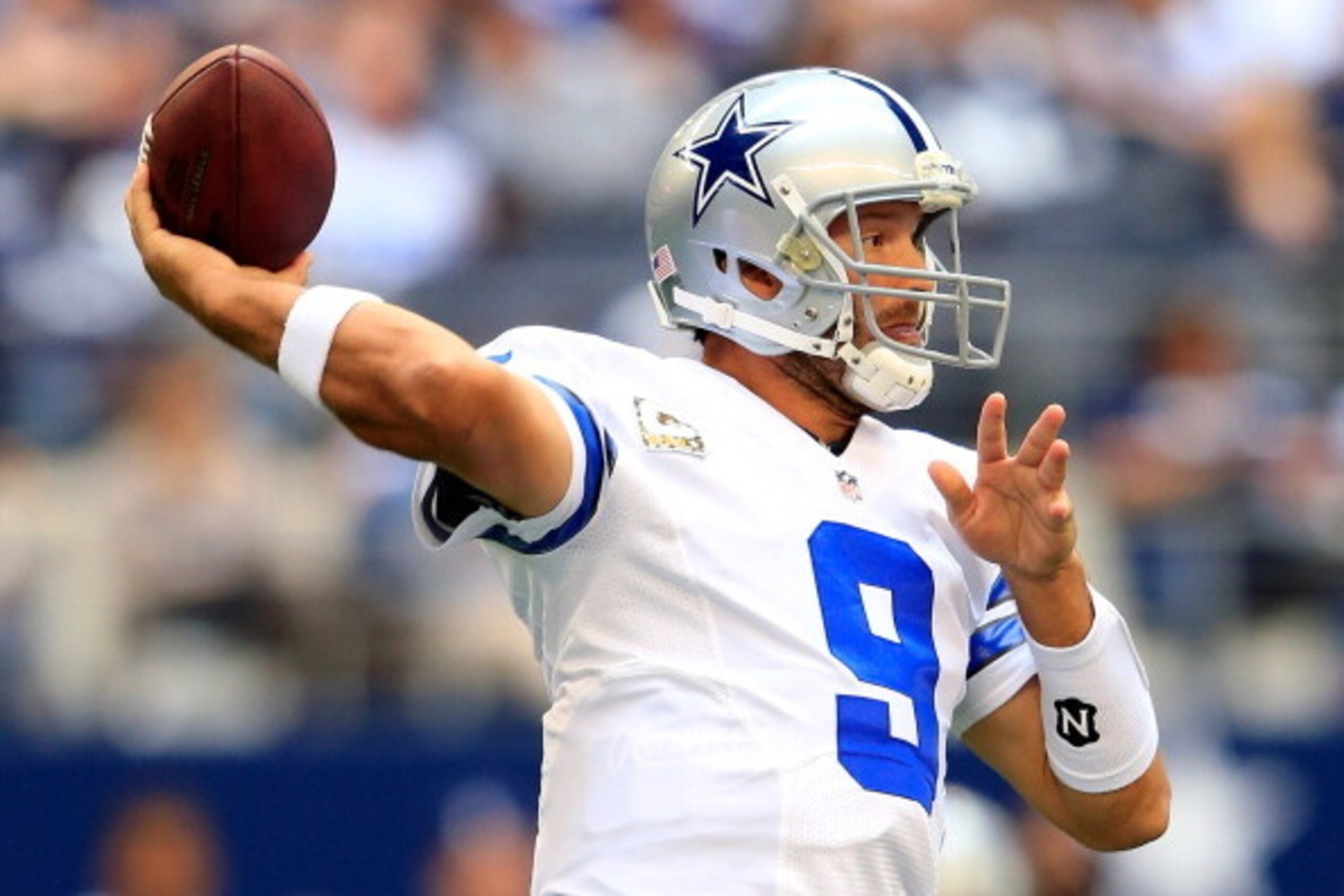 ARLINGTON, TX - NOVEMBER 03:  Quarterback Tony Romo #9 of the Dallas Cowboys passes during the game against the Minnesota Vikings at Cowboys Stadium on November 3, 2013 in Arlington, Texas.  (Photo by Jamie Squire/Getty Images)