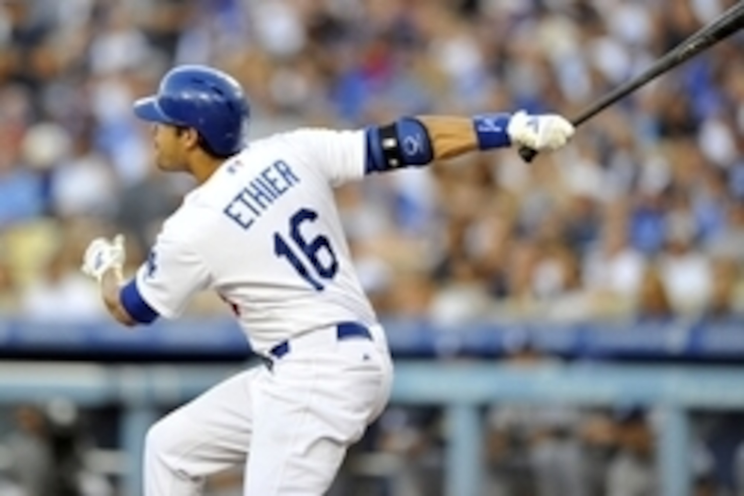July 12, 2014; Los Angeles, CA, USA; Los Angeles Dodgers center fielder Andre Ethier (16) hits a single in the second inning against the San Diego Padres at Dodger Stadium. Mandatory Credit: Gary A. Vasquez-USA TODAY Sports