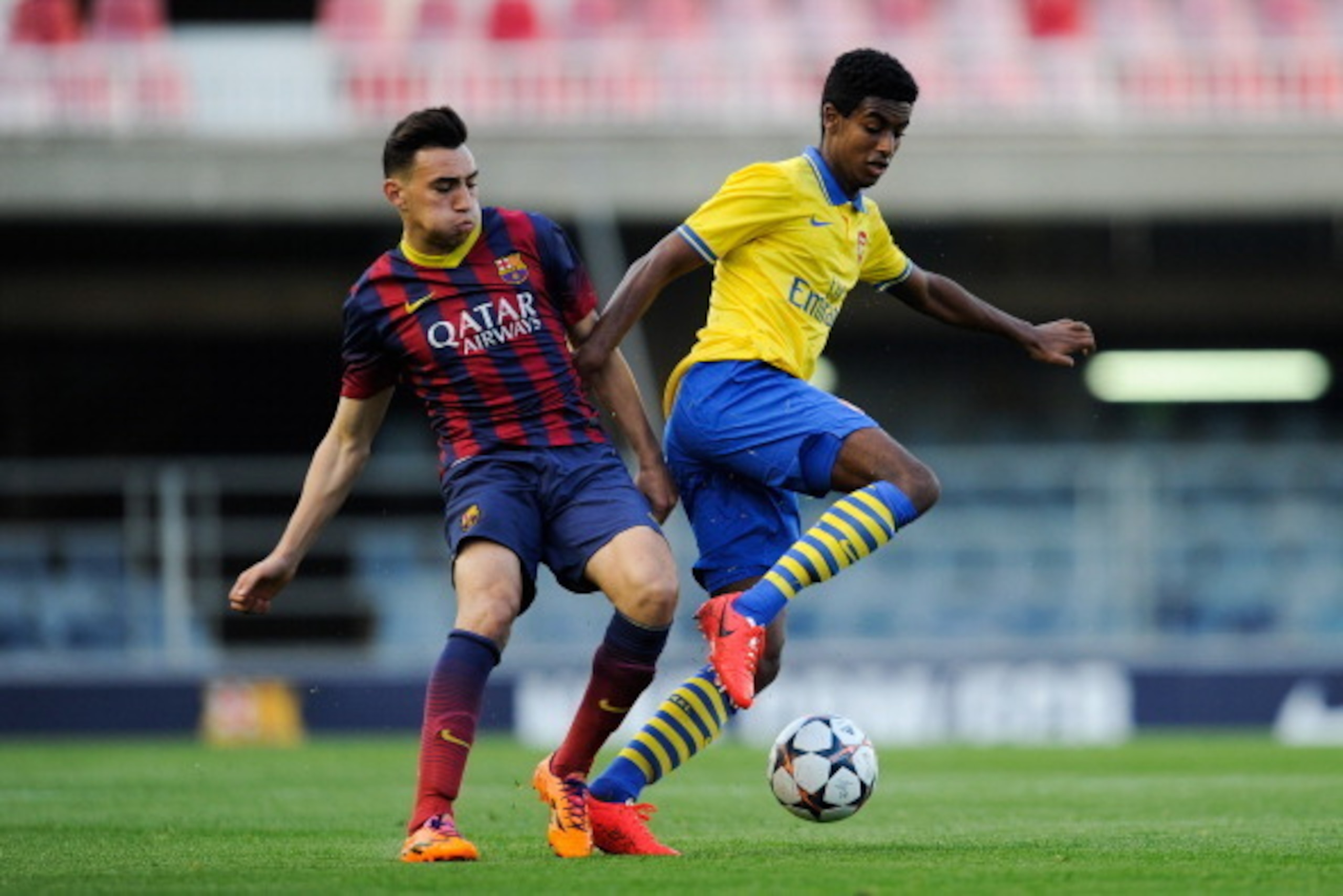 BARCELONA, SPAIN - MARCH 18:  Gedion Zelalem of Arsenal duels for the ball with Munir El Haddadi of FC Barcelona during the UEFA Youth League Quarter FInal match between FC Barcelona U19 and Arsenal U19 at Mini Estadi on March 18, 2014 in Barcelona, Spain