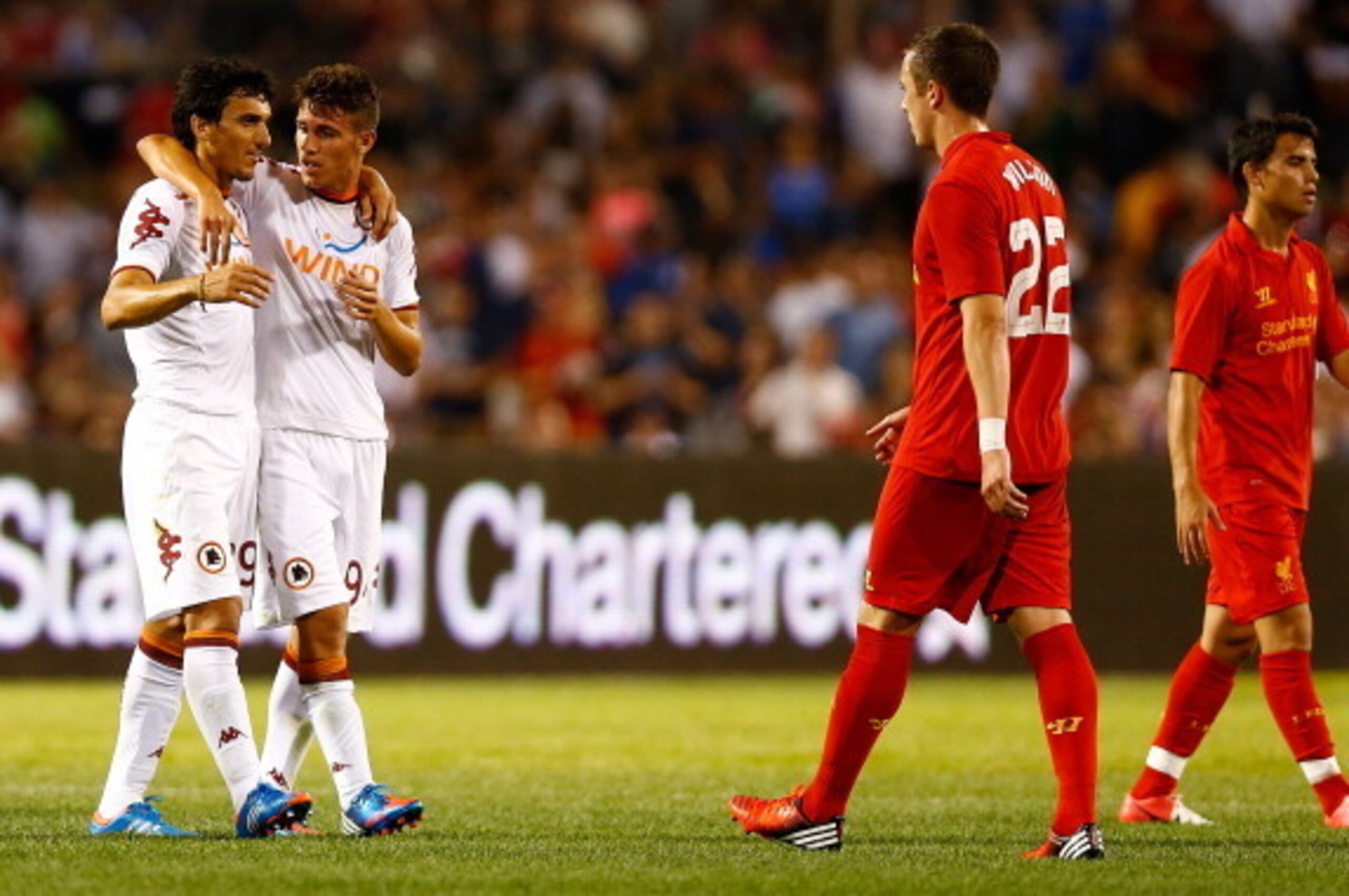 BOSTON, MA - JULY 25: Nicolas Burdisso #29 and teammate Kellen Gulley #94 of AS Roma celebrate following their win against Liverpool during a pre-season tour friendly match on July 25, 2012 at Fenway Park in Boston, Massachusetts.  (Photo by Jared Wickerh