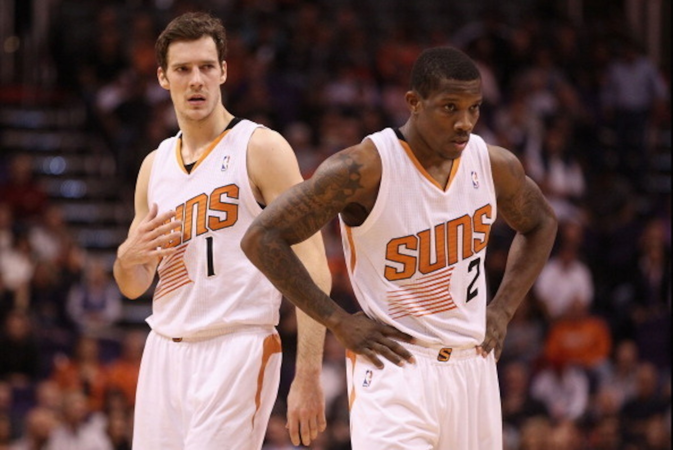 PHOENIX, AZ - DECEMBER 18:  Goran Dragic #1 and Eric Bledsoe #2 of the Phoenix Suns await a free throw shot during the NBA game against the San Antonio Spurs at US Airways Center on December 18, 2013 in Phoenix, Arizona. The Spurs defeated the 108-101.  N