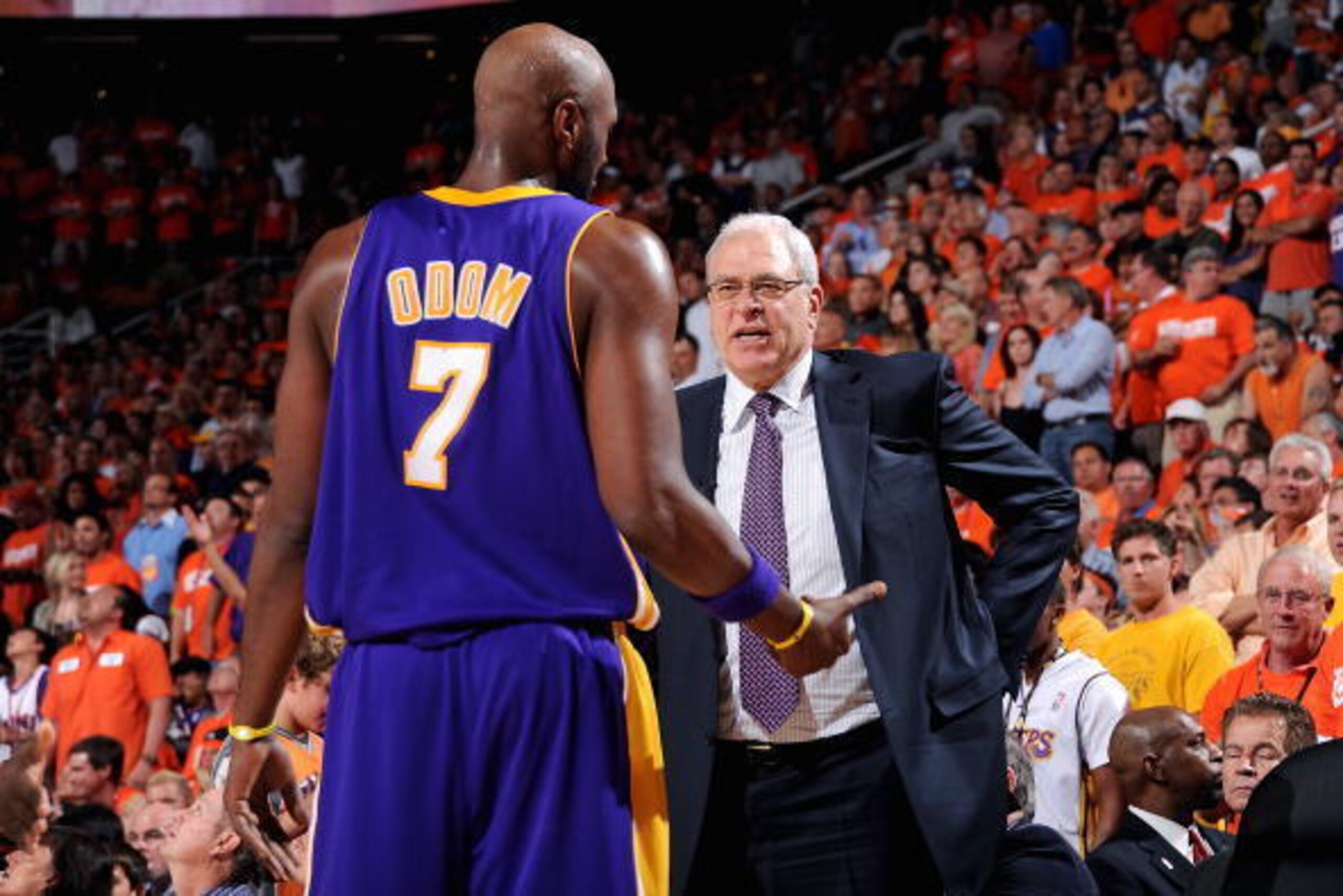 PHOENIX - MAY 23:  Lamar Odom #7 talks to head coach Phil Jackson of the Los Angeles Lakers in Game Three of the Western Conference Finals against the Phoenix Suns  during the 2010 NBA Playoffs on May 23, 2010 at US Airways Center in Phoenix, Arizona.  Th