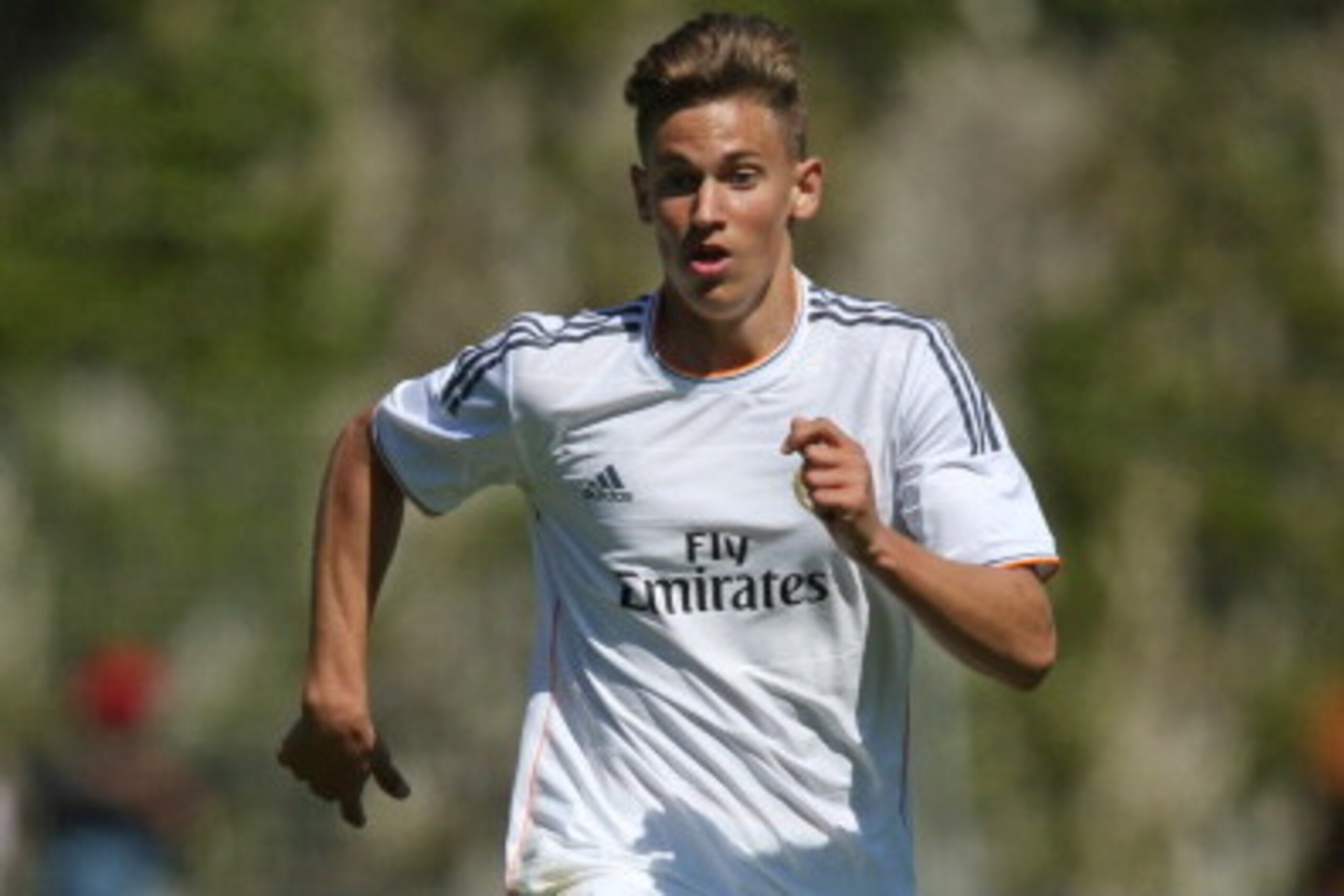 NYON, SWITZERLAND - APRIL 11: Marcos Llorente of Real Madrid runs with the ball during the UEFA Youth League Semi Final match between Real Madrid and Benfica Lisbon at Colovray Stadion on April 11, 2014 in Nyon, Switzerland. (Photo by Philipp Schmidli/Get