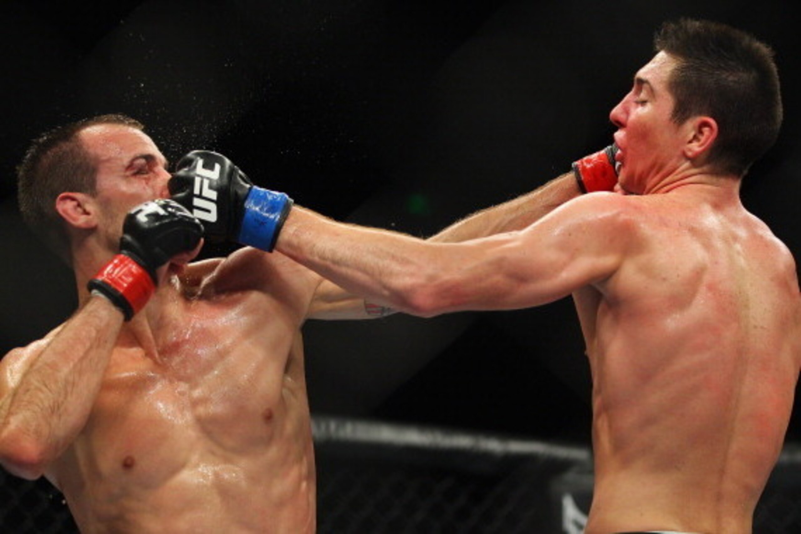 SYDNEY, AUSTRALIA - MARCH 03:  Cole Miller of the USA and Steven Siler of the USA exchange punches during the USC On FX featherweight bout between Cole Miller and Steven Siler at Allphones Arena on March 3, 2012 in Sydney, Australia.  (Photo by Mark Kolbe