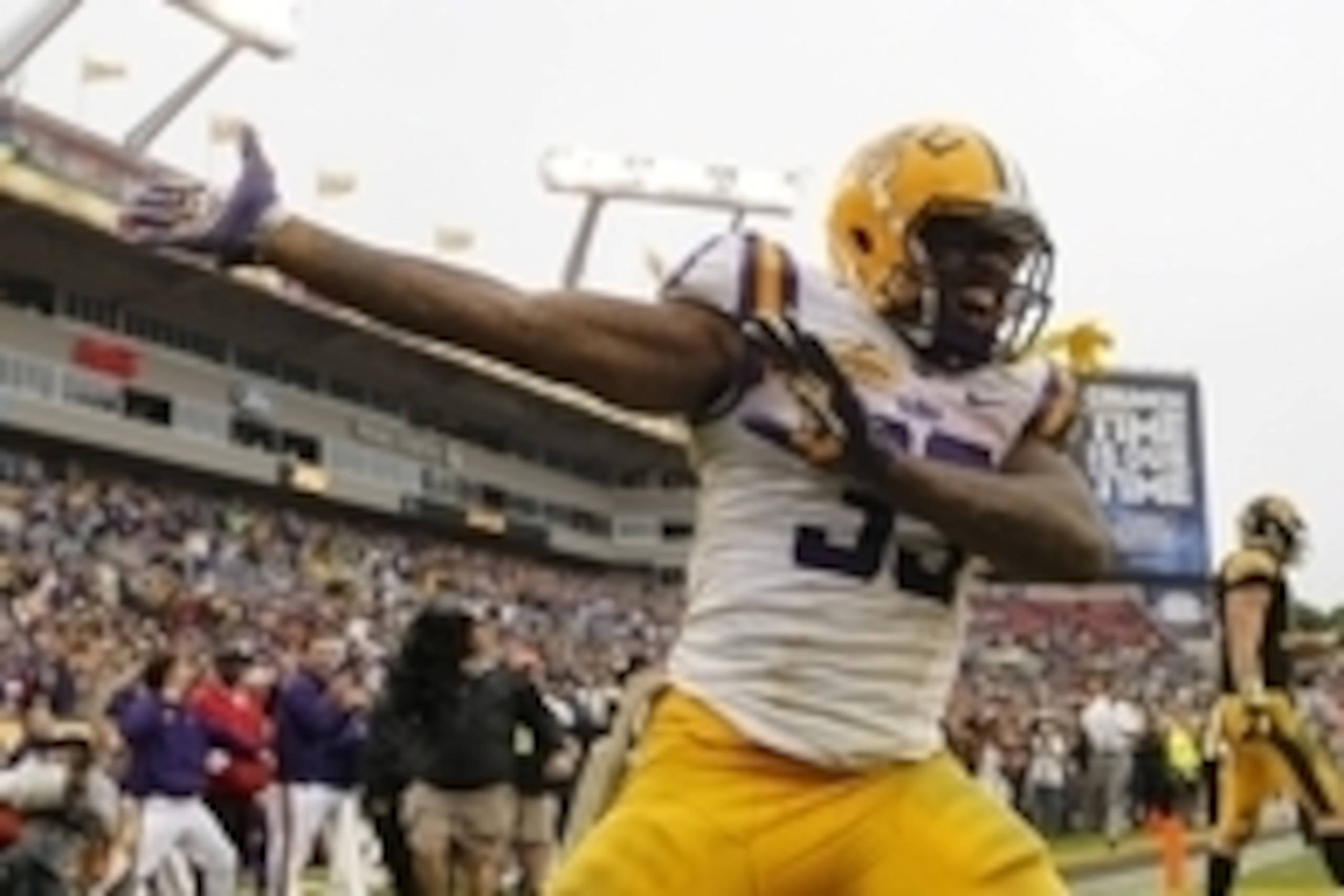 Jan 1, 2014; Tampa, Fl, USA; LSU Tigers running back Jeremy Hill (33) reacts and celebrates after he scored a touchdown against the Iowa Hawkeyes during the second half at Raymond James Stadium. LSU Tigers defeated the Iowa Hawkeyes 21-14. Mandatory Credi