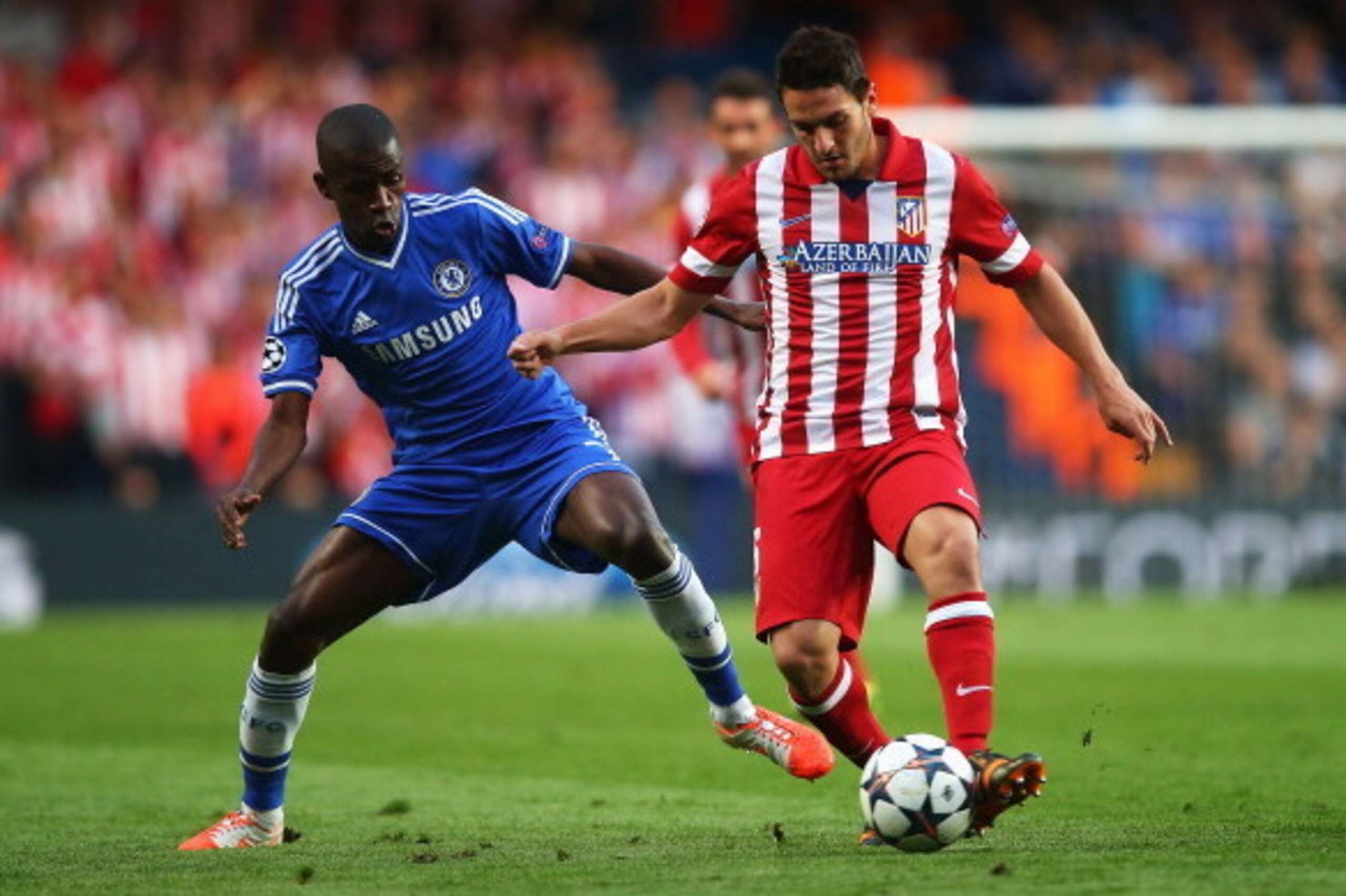 LONDON, ENGLAND - APRIL 30: Koke of Club Atletico de Madrid is tackled by Ramires of Chelsea during the UEFA Champions League semi-final second leg match between Chelsea and Club Atletico de Madrid at Stamford Bridge on April 30, 2014 in London, England. 