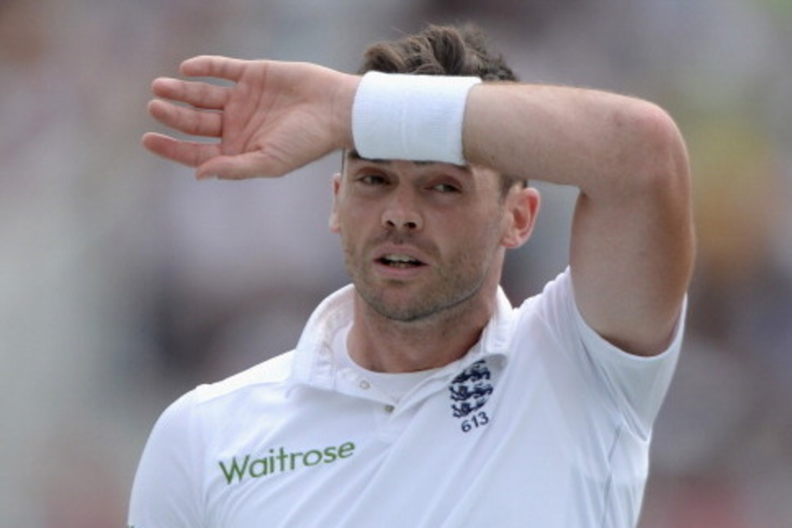 NOTTINGHAM, ENGLAND - JULY 12:  James Anderson of England wipes his brow during day four of 1st Investec Test match between England and India at Trent Bridge on July 12, 2014 in Nottingham, England.  (Photo by Gareth Copley/Getty Images)