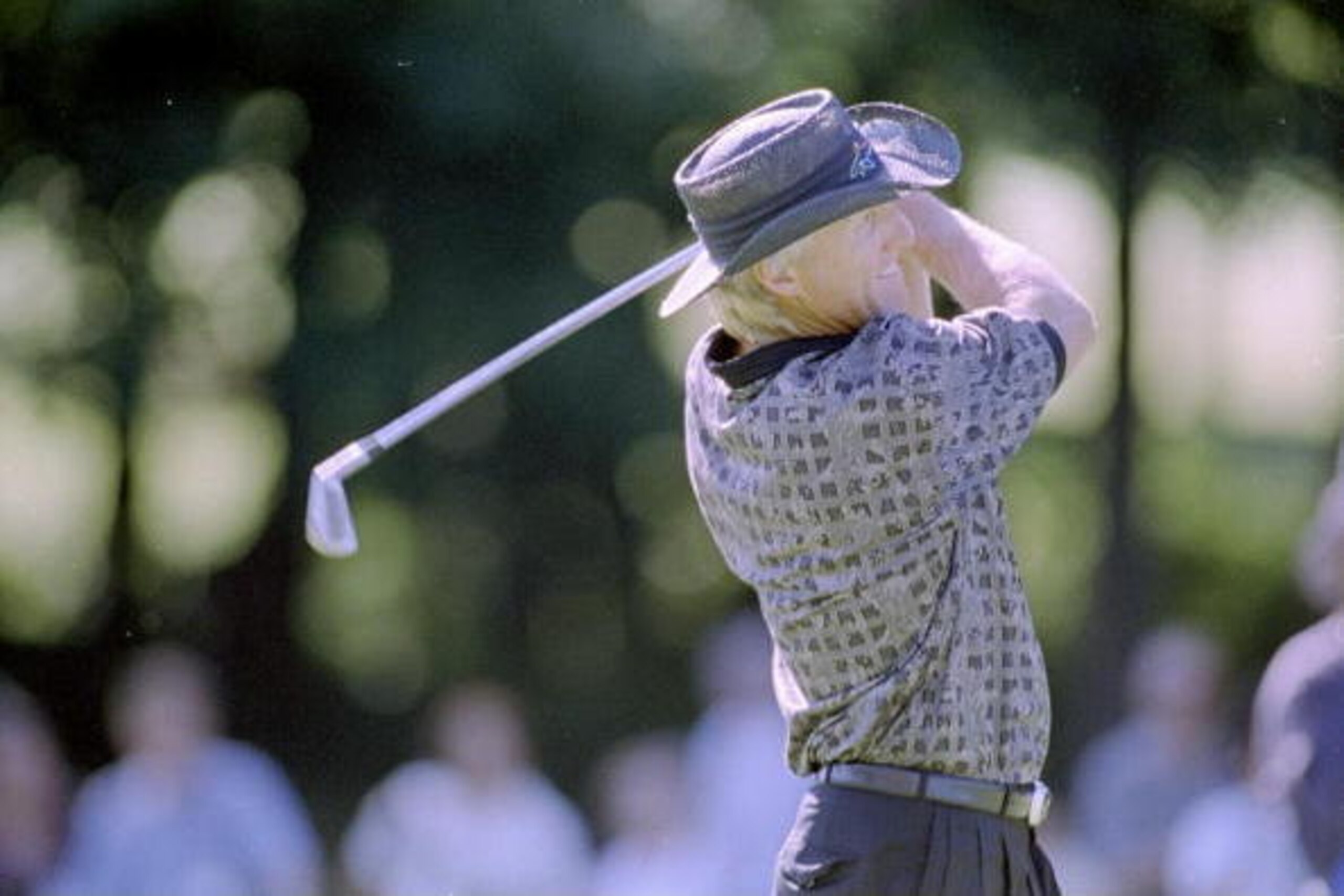 5 Sep 1997: Greg Norman hits the ball during the Canadian Open at the Royal Montreal Golf Course in Montreal, Quebec.