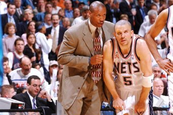 EAST RUTHERFORD, NJ - MAY 15:    Byron Scott talks with his point guard Jason Kidd #5 on how to defend the Charlotte Hornets offense during the 2002 NBA Eastern Conference semifinals at the Continental Airlines Arena in East Rutherford, New Jersey on May 