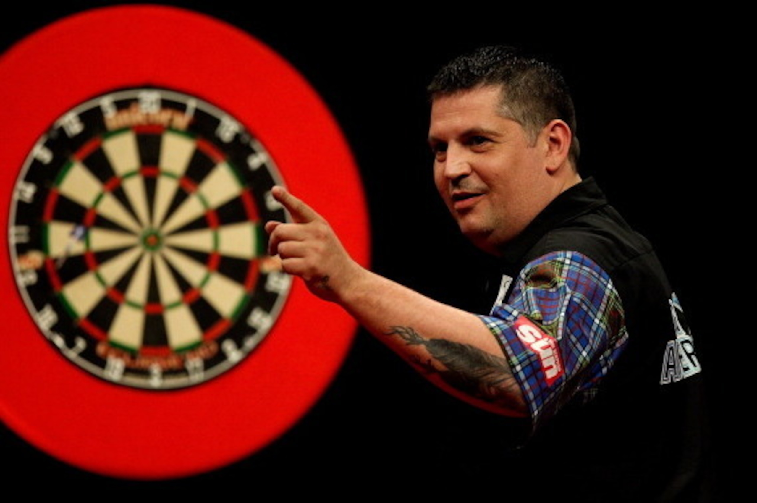 LONDON, ENGLAND - MAY 22: Gary Anderson of Scotland celebrates winning a leg during the McCoys Premier League Darts Play-Offs Semi Final match between Michael van Gerwen and Gary Anderson at O2 Arena on May 22, 2014 in London, England.  (Photo by Ben Hosk