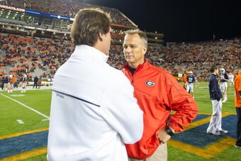 AUBURN, AL - NOVEMBER 10:  Coach Mark Richt of the Georgia Bulldogs chats with defensive coordinator Brian VanGorder of the Auburn Tigers before their game on November 10, 2012 at Jordan-Hare Stadium in Auburn, Alabama. Georgia defeated Auburn 38-0 and cl