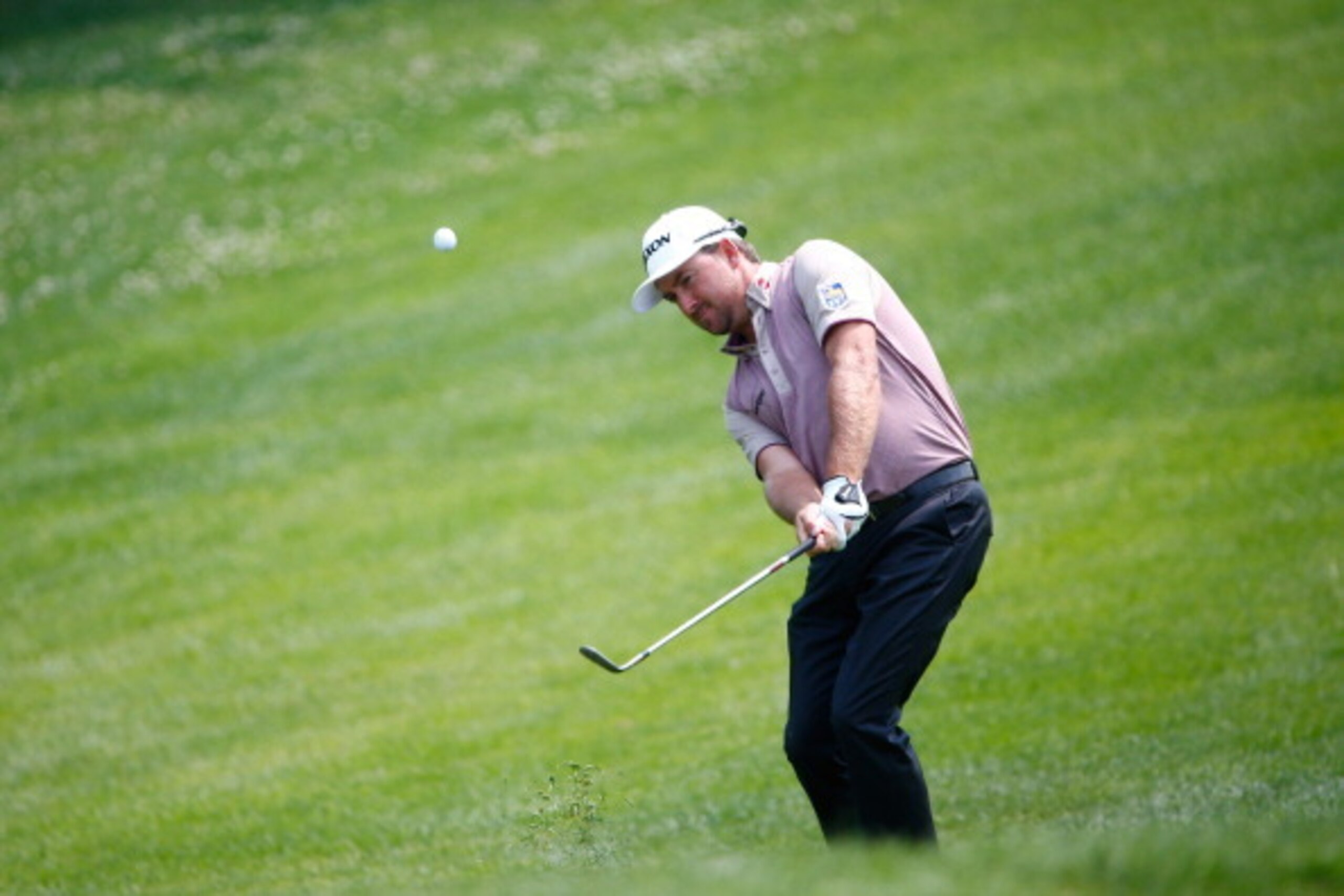 MONTREAL, QC - JULY 25:  Graeme McDowell of Northern Ireland chips to the sixth green during the second round of the RBC Canadian Open at the Royal Montreal Golf Club on July 25, 2014 in Montreal, Quebec, Canada.  (Photo by Sam Greenwood/Getty Images)