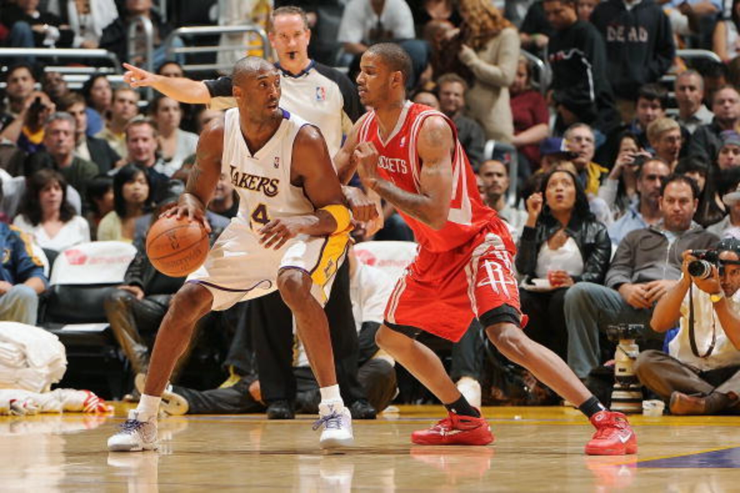 LOS ANGELES - NOVEMBER 15:  Kobe Bryant #24 of the Los Angeles Lakers drives the ball against Trevor Ariza #1 of the Houston Rockets during the game on November 15, 2009 at Staples Center in Los Angeles, California.  The Rockets won 101-91.  NOTE TO USER: