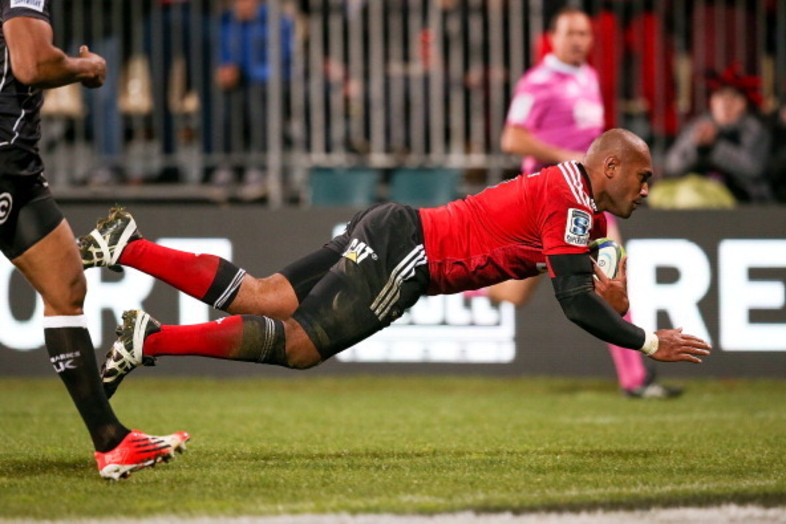 CHRISTCHURCH, NEW ZEALAND - JULY 26:  Nemani Nadolo of the Crusaders dives over to score a try during the Super Ruby Semi Final match between the Crusaders and the Sharks at AMI Stadium on July 26, 2014 in Christchurch, New Zealand.  (Photo by Martin Hunt