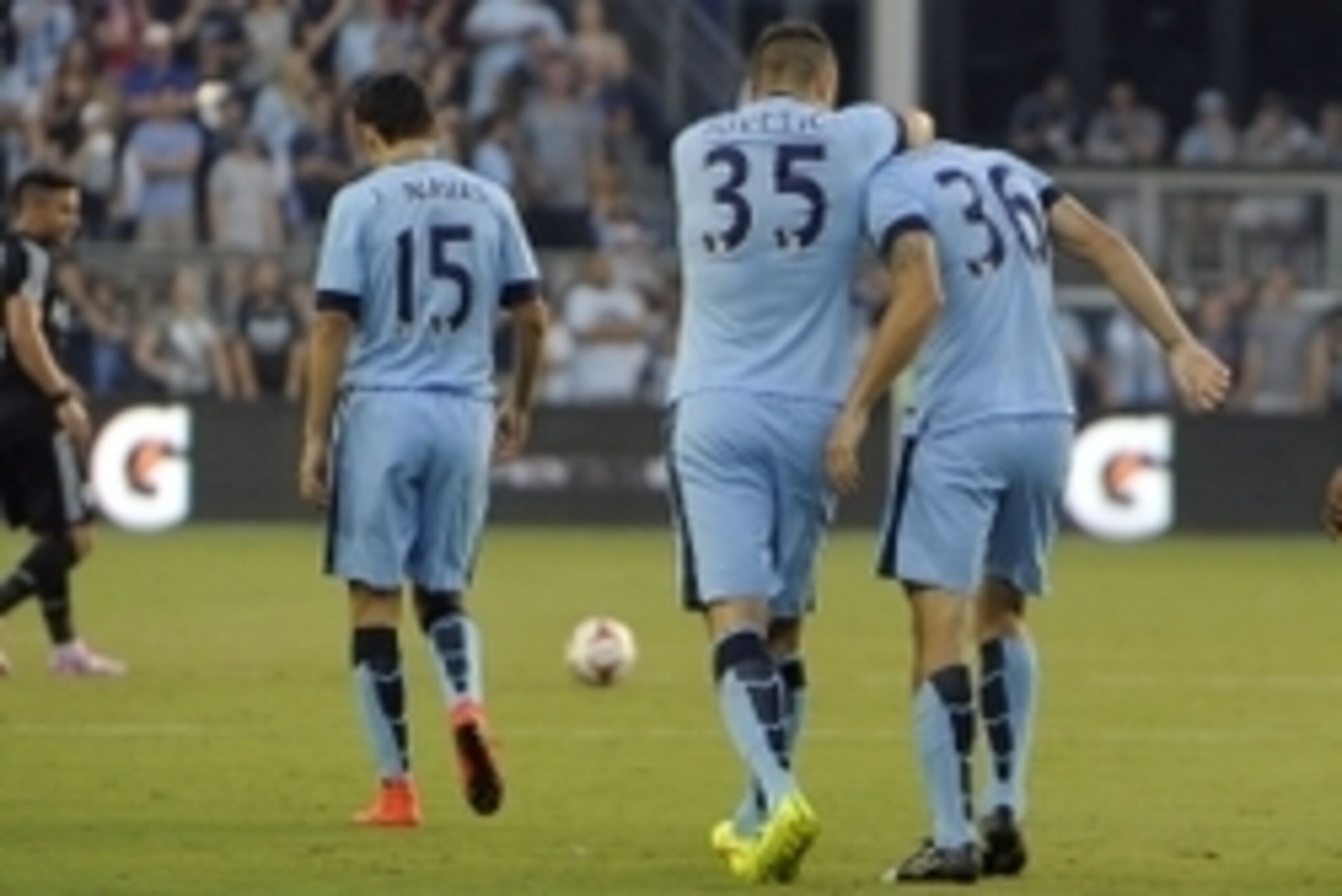 Jul 23, 2014; Kansas City, KS, USA; Manchester City midfielder Bruno Zuculini (36) is congratulated by forward Stevan Jovetic (35) after scoring a goal against the Sporting KC in the first half  at Sporting Park. Mandatory Credit: John Rieger-USA TODAY Sp