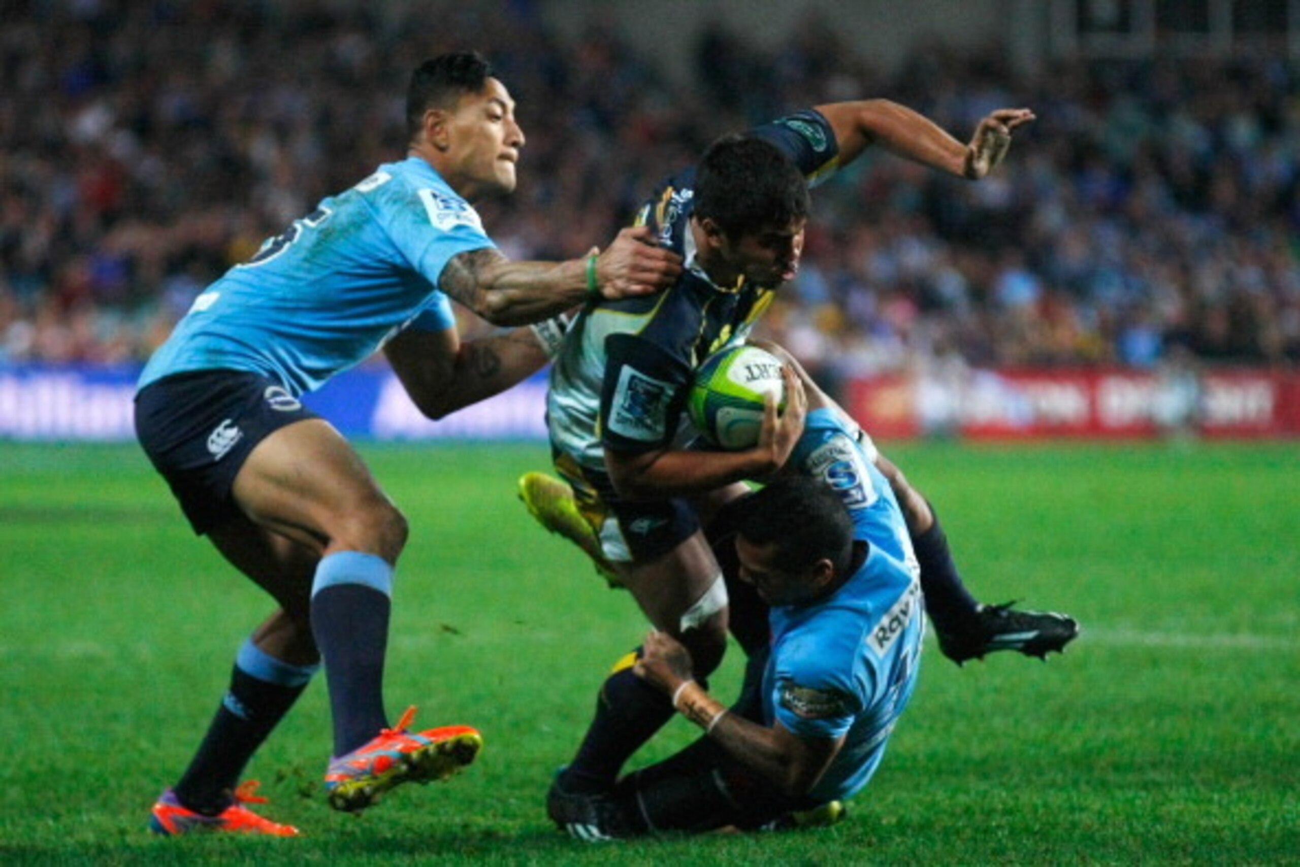 SYDNEY, AUSTRALIA - JULY 26: Jarrad Butler of the Brumbies is tackled during the Super Rugby Semi Final match between the Waratahs and the Brumbies at Allianz Stadium on July 26, 2014 in Sydney, Australia.  (Photo by Joosep Martinson/Getty Images)