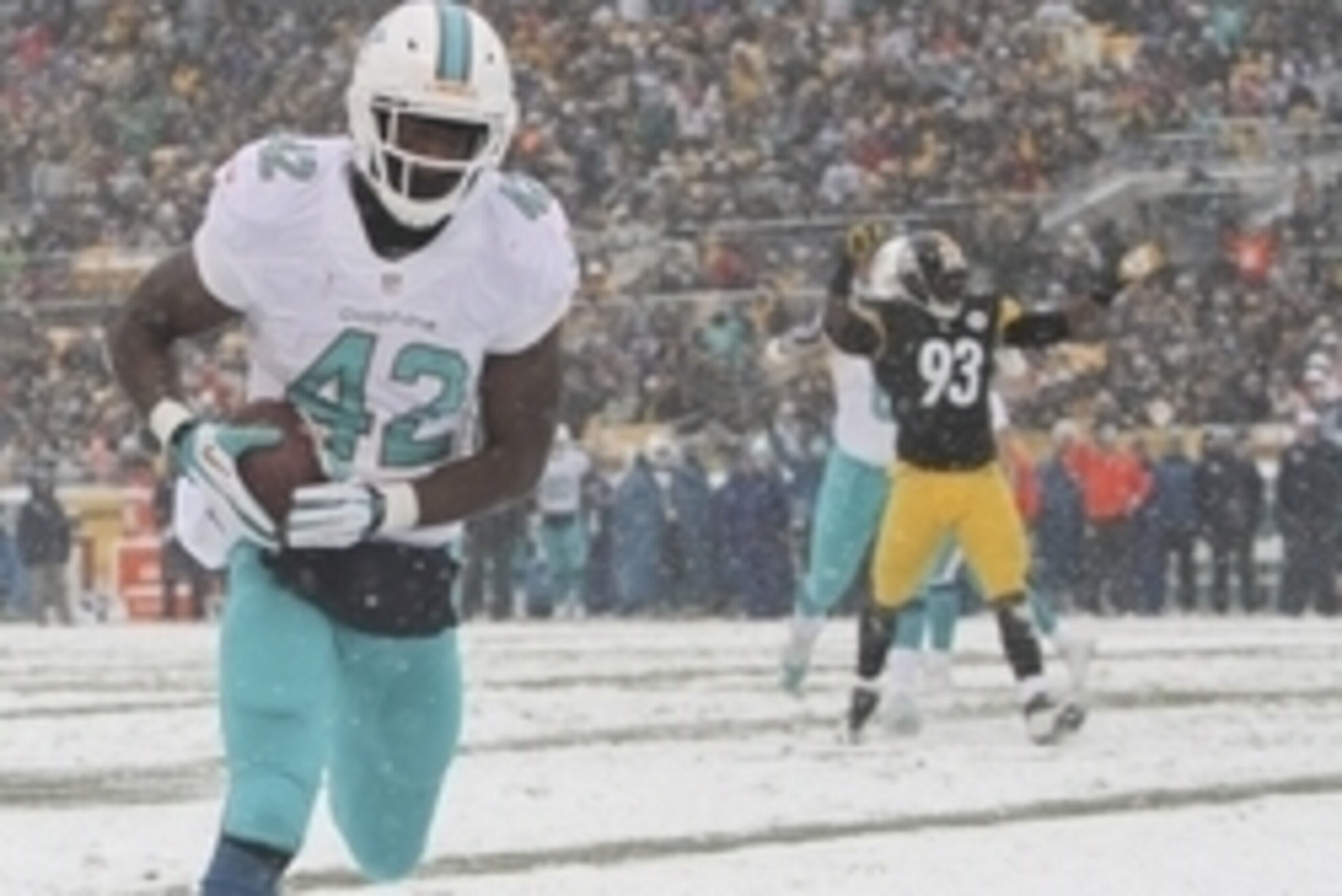 Dec 8, 2013; Pittsburgh, PA, USA; Miami Dolphins tight end Charles Clay (42) scores a touchdown as Pittsburgh Steelers linebacker Jason Worilds (93) stands in the background during the first half at Heinz Field. Mandatory Credit: Jason Bridge-USA TODAY Sp Dec 8, 2013; Pittsburgh, PA, USA; Miami Dolphins tight end Charles Clay (42) scores a touchdown as Pittsburgh Steelers linebacker Jason Worilds (93) stands in the background during the first half at Heinz Field. Mandatory Credit: Jason Bridge-USA TODAY Sp