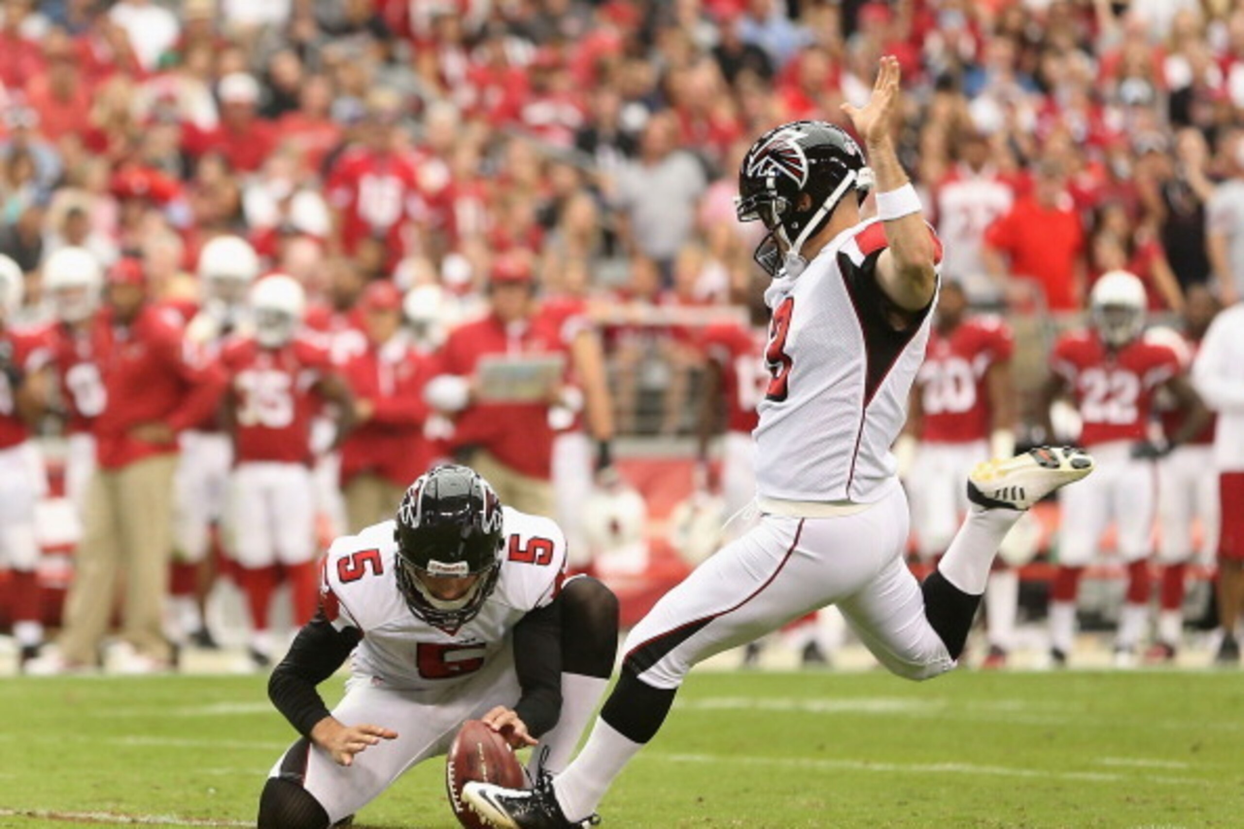 GLENDALE, AZ - OCTOBER 27:  Kicker Matt Bryant #3 of the Atlanta Falcons kicks a field goal held by punter Matt Bosher #5 during the NFL game against the Arizona Cardinals at the University of Phoenix Stadium on October 27, 2013 in Glendale, Arizona. The 