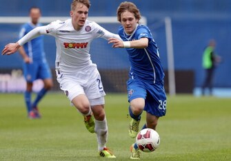 ZAGREB,CROATIA - MAY 17:  Alen Halilovic (R) of FC Dinamo Zagreb is challenged by Filip Bradaric (L) of FC Hajduk Split  during the Croatian Prva HNL Liga match between FC Dinamo Zagreb and FC Hajduk Split at the Maksimir Stadium on May. 17, 2014 in Zagre