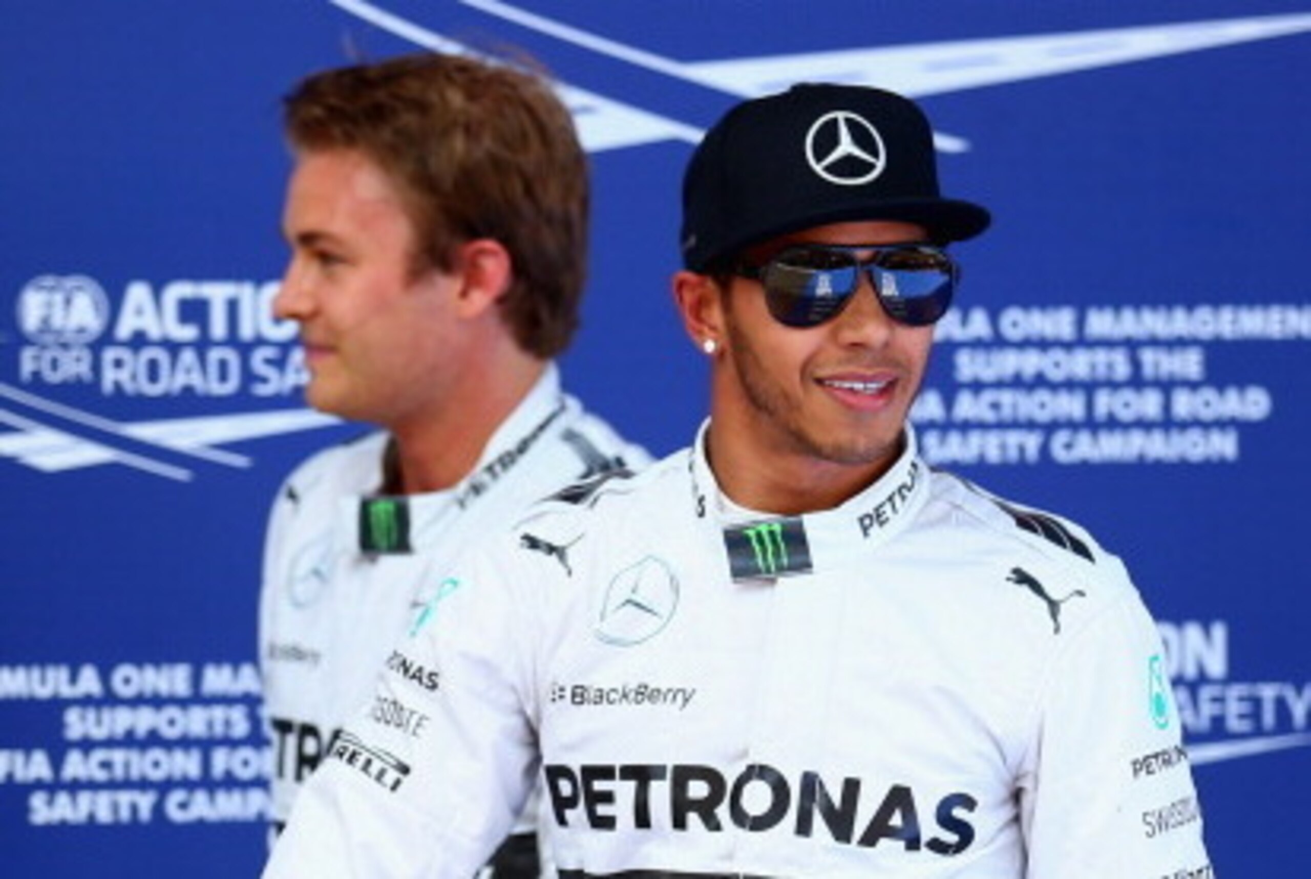 MONTMELO, SPAIN - MAY 10:  Lewis Hamilton of Great Britain and Mercedes GP celebrates with team-mate Nico Rosberg of Germany and Mercedes GP after qualifying in pole position ahead of the Spanish F1 Grand Prix at Circuit de Catalunya on May 10, 2014 in Mo
