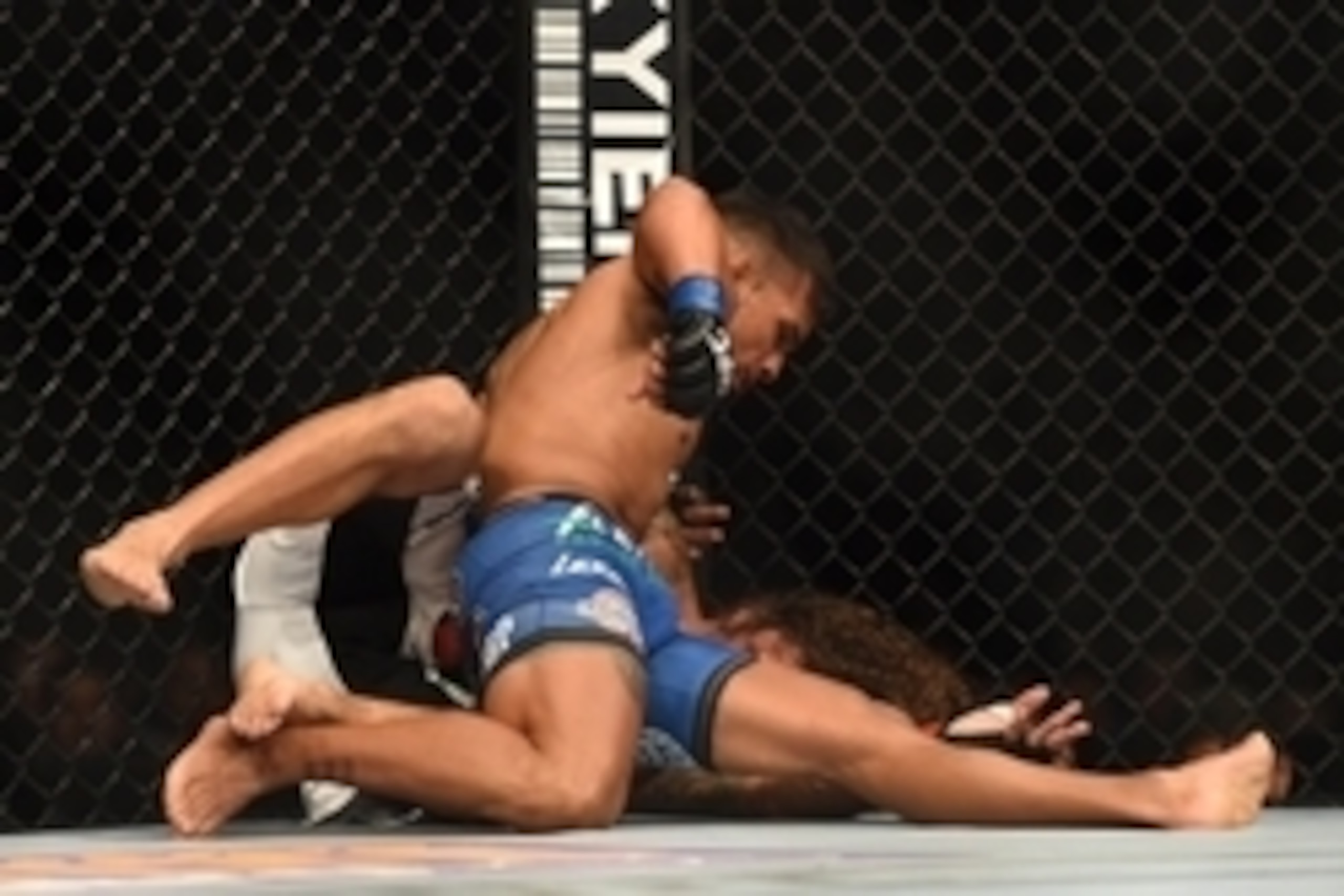 July 26, 2014; San Jose, CA, USA; Clay Guida (red gloves) is pinned down by Dennis Bermudez (blue gloves) during the featherweight bout of the FOX UFC Saturday at SAP Center. Mandatory Credit: Kyle Terada-USA TODAY Sports