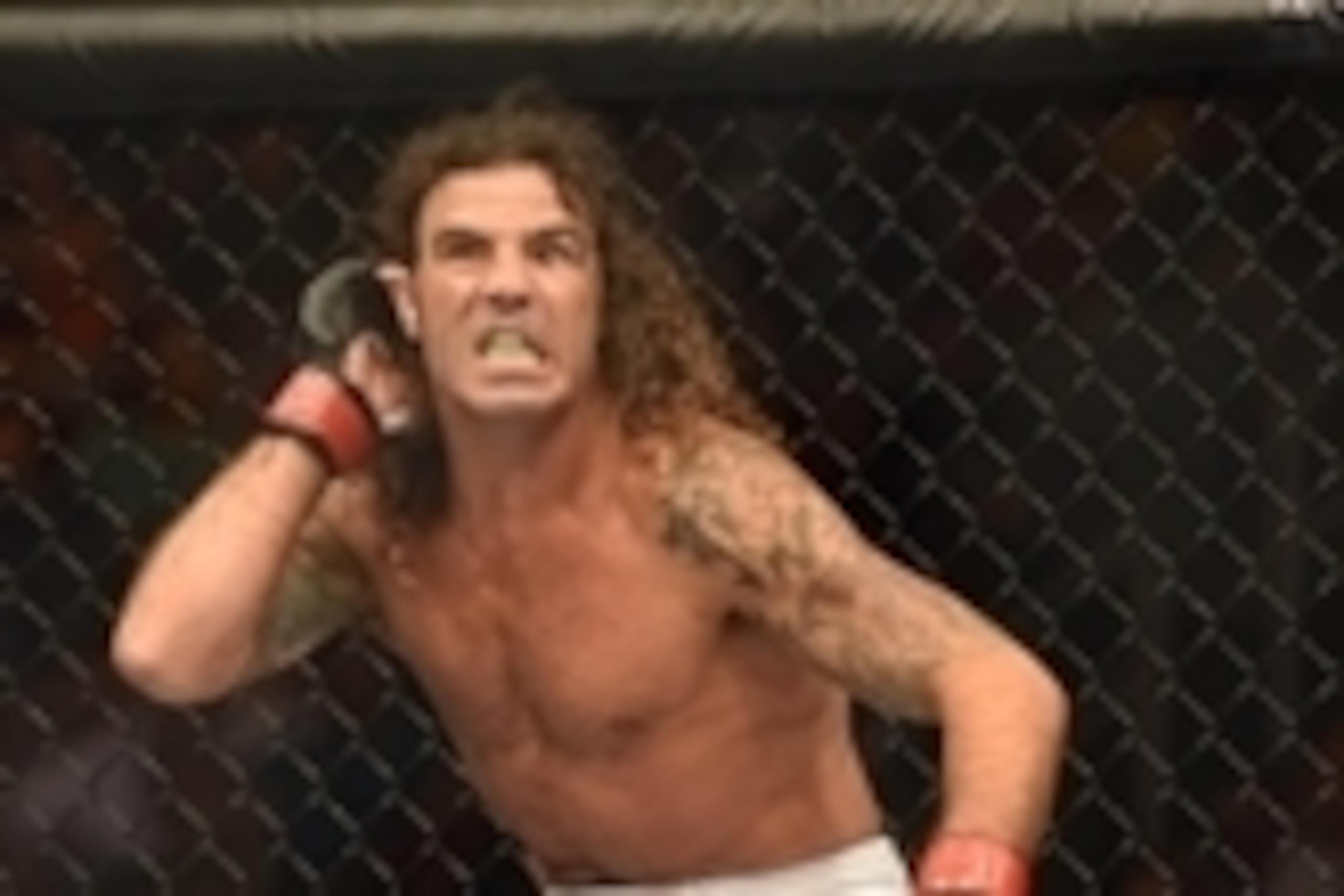 July 26, 2014; San Jose, CA, USA; Clay Guida (red gloves) before the featherweight bout of the FOX UFC Saturday at SAP Center. Mandatory Credit: Kyle Terada-USA TODAY Sports
