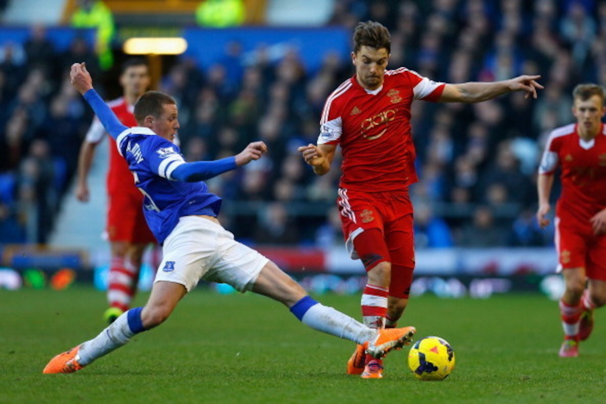 LIVERPOOL, ENGLAND - DECEMBER 29:  James McCarthy of Everton challenges Jay Rodriguez of Southampton during the Barclays Premier League match between Everton and Southampton at Goodison Park on December 29, 2013 in Liverpool, England.  (Photo by Paul Thom