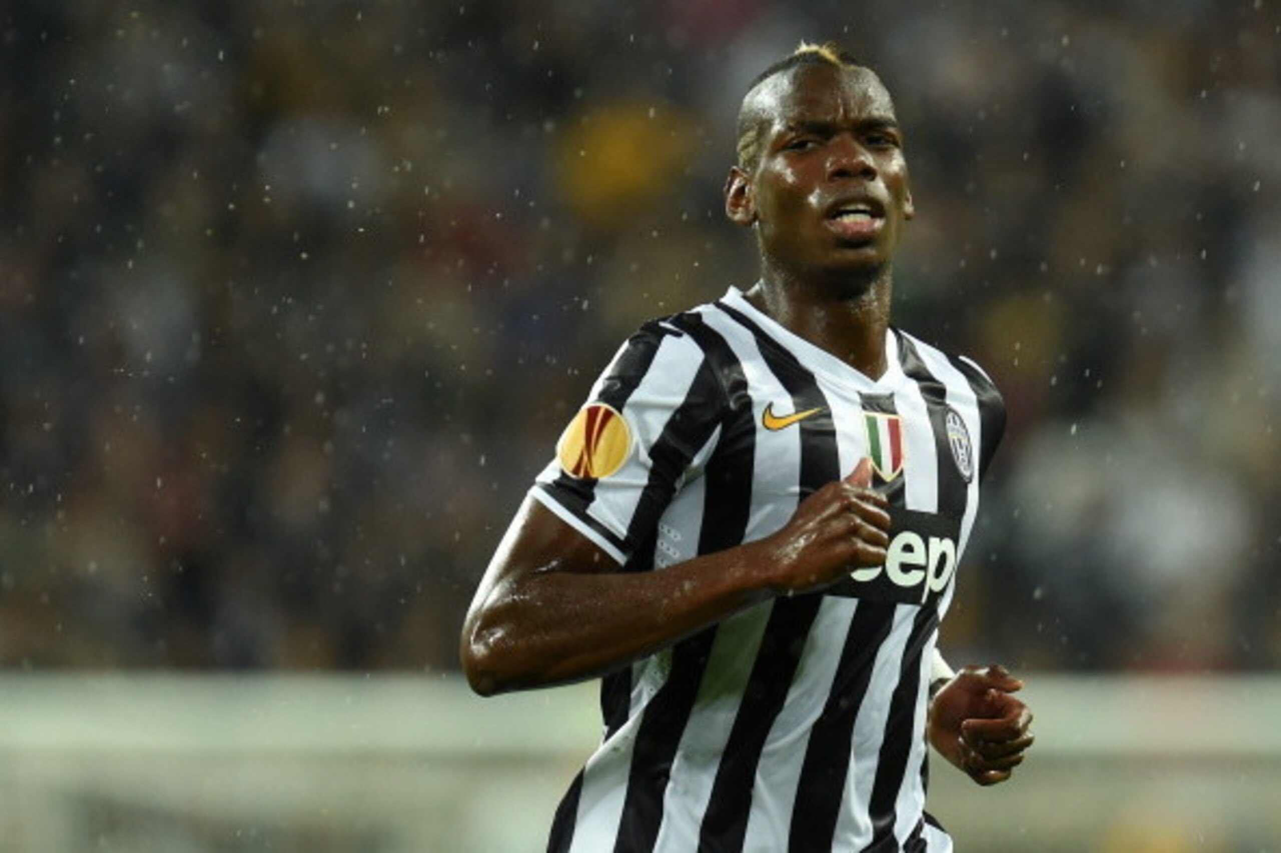 TURIN, ITALY - MAY 01:  Paul Pogba of Juventus looks on during the UEFA Europa League semi final match between Juventus and SL Benfica at Juventus Arena on May 1, 2014 in Turin, Italy.  (Photo by Valerio Pennicino/Getty Images)