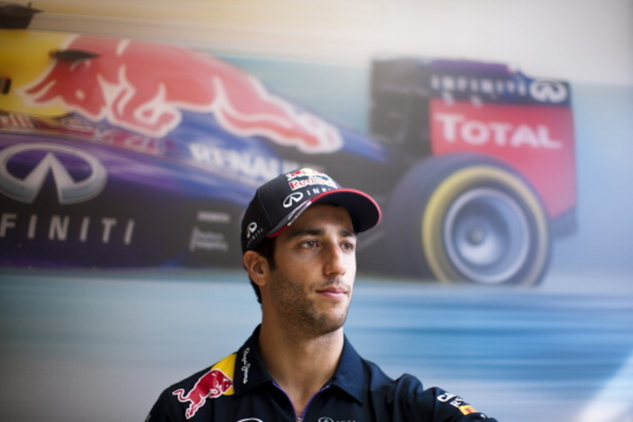 BUDAPEST, HUNGARY - JULY 26:  Daniel Ricciardo of Australia and Infiniti Red Bull Racing speaks with members of the media after qualifying ahead of the Hungarian Formula One Grand Prix at Hungaroring on July 26, 2014 in Budapest, Hungary.  (Photo by Drew 