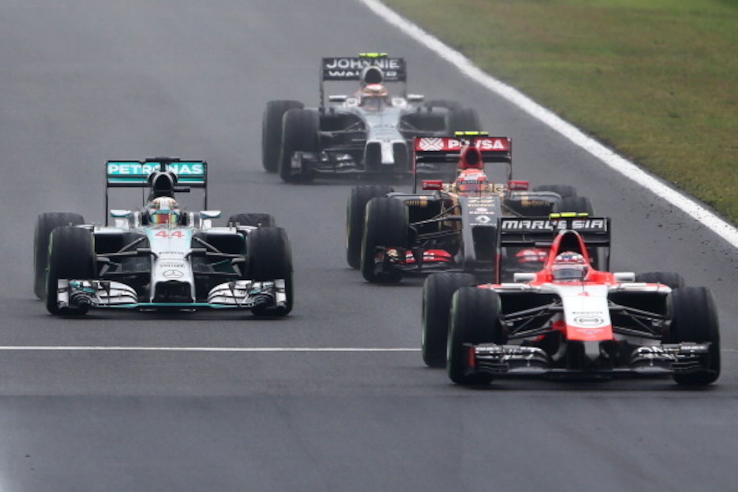 BUDAPEST, HUNGARY - JULY 27:  Lewis Hamilton of Great Britain and Mercedes GP 
drives next to Max Chilton of Great Britain and Marussia, Pastor Maldonado of Venezuela and Lotus and Kevin Magnussen of Denmark and McLaren during the Hungarian Formula One Gr