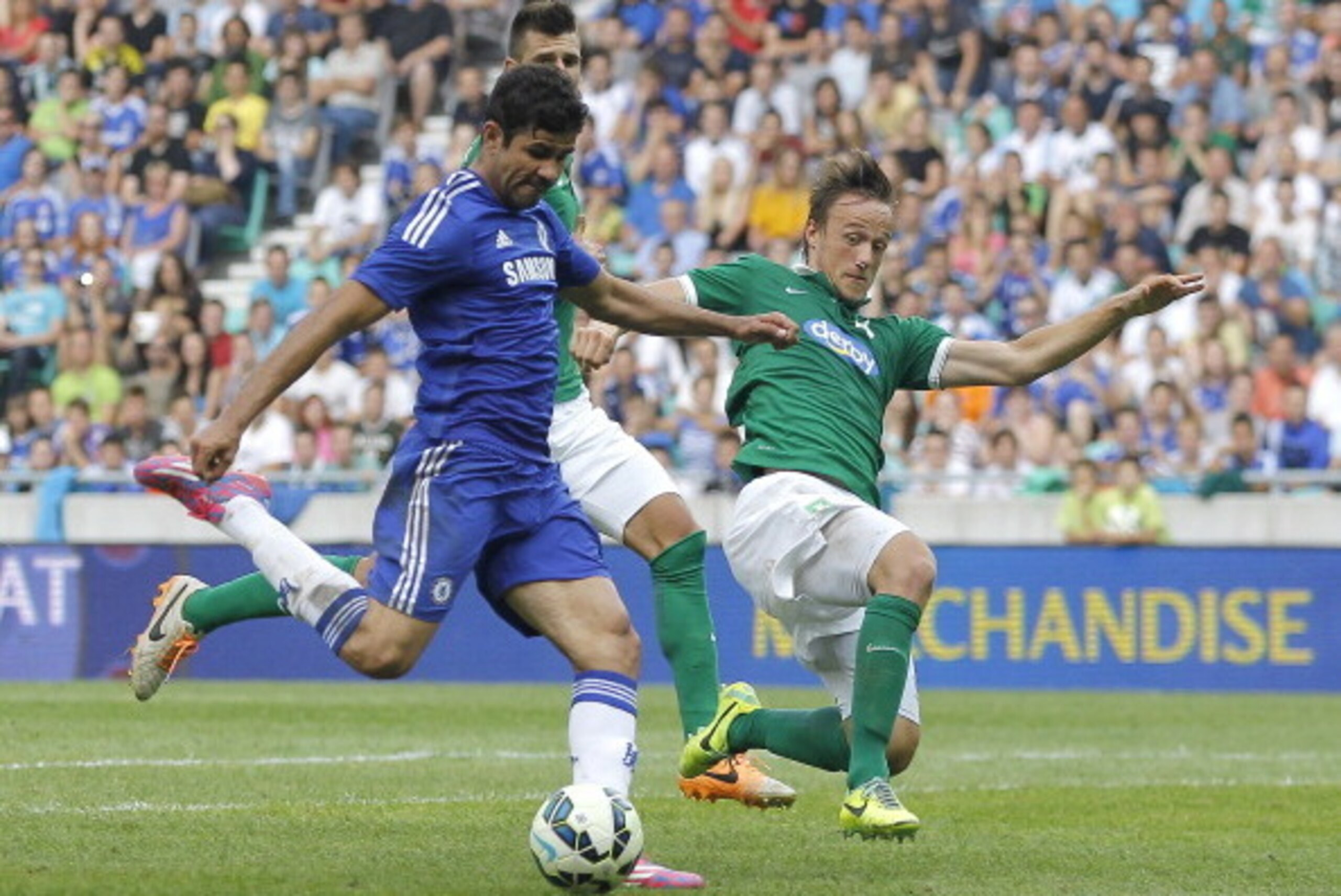 LJUBLJANA, SLOVENIA - JULY 27: Diego Costa (L) of FC Chelsea scores the goal near Antonio Mlinar Delamea (L) of FC Olimpija Ljubljana during the Pre Season Friendly  match between FC Olimpija Ljubljana and FC Chelsea at Stozice stadium in Ljubljana, Slove