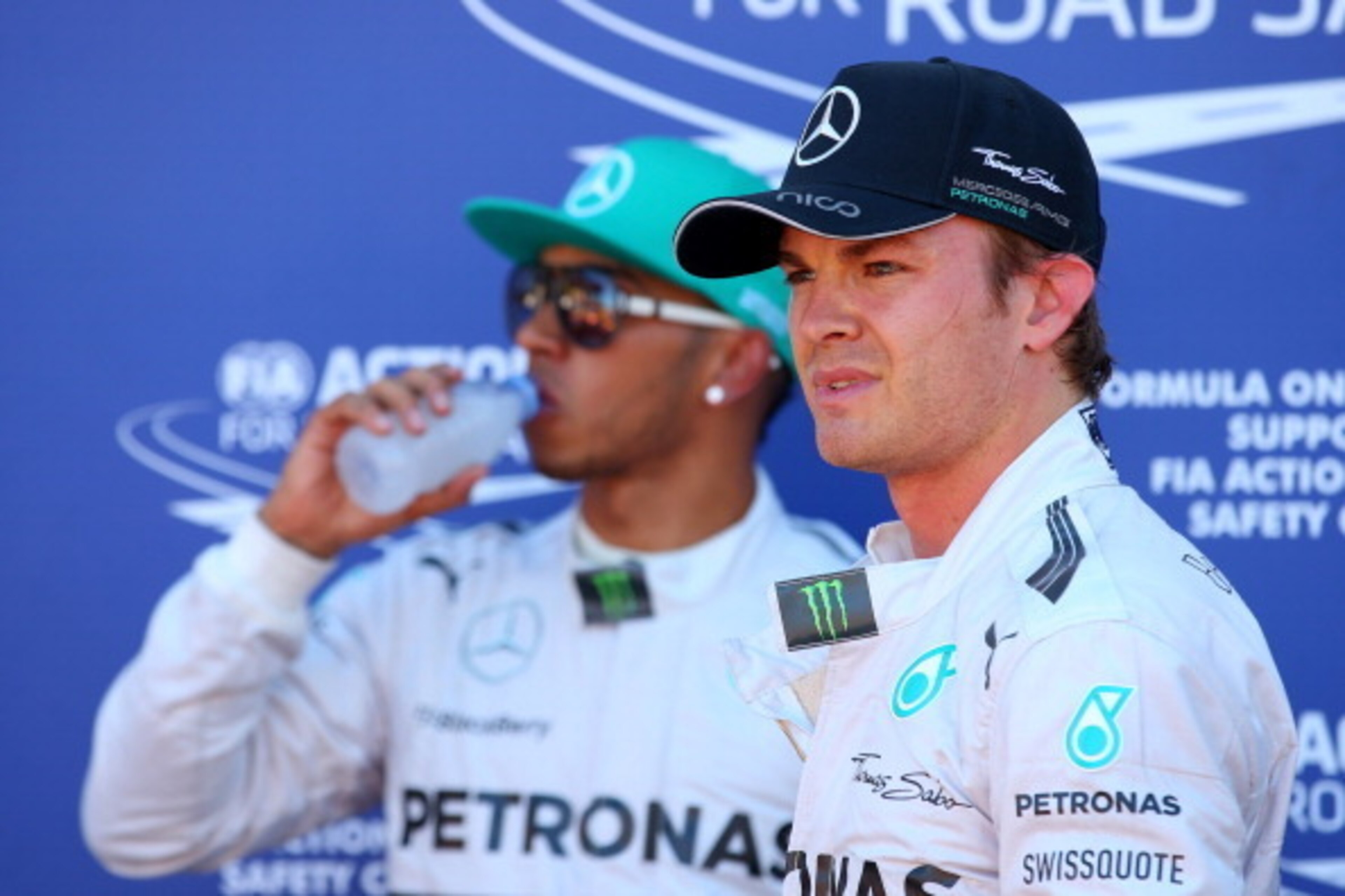 MONTE-CARLO, MONACO - MAY 24:  Teammates Nico Rosberg of Germany and Mercedes GP and Lewis Hamilton of Great Britain and Mercedes GP look on following qualifying ahead of the Monaco Formula One Grand Prix at Circuit de Monaco on May 24, 2014 in Monte-Carl