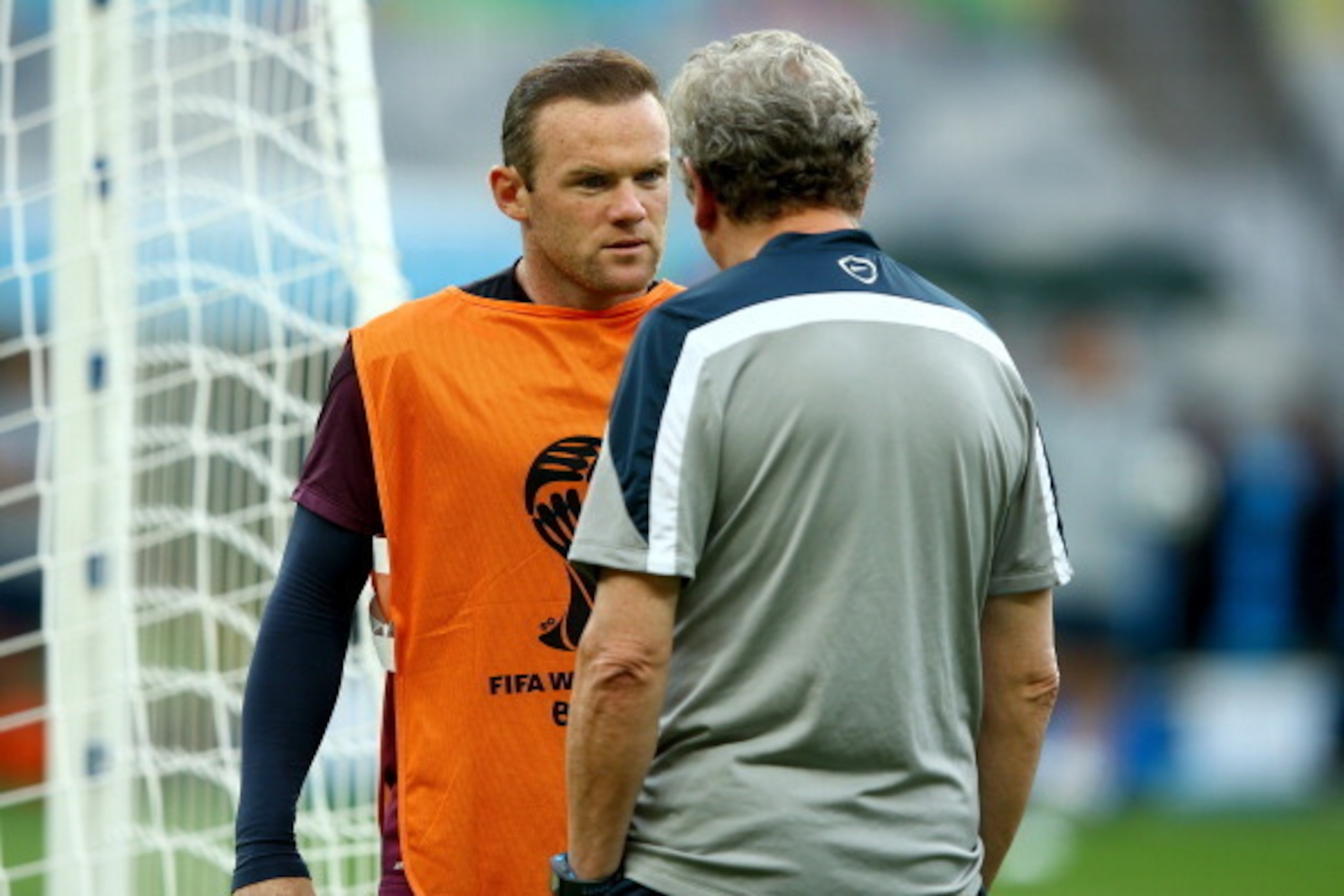 BELO HORIZONTE, BRAZIL - JUNE 23:   England Manager Roy Hodgson speaks to Wayne Rooney during an England training session ahead of the 2014 FIFA World Cup Brazil Group D match against Costa Rica at Estadio Mineirao on June 23, 2014 in Belo Horizonte, Braz