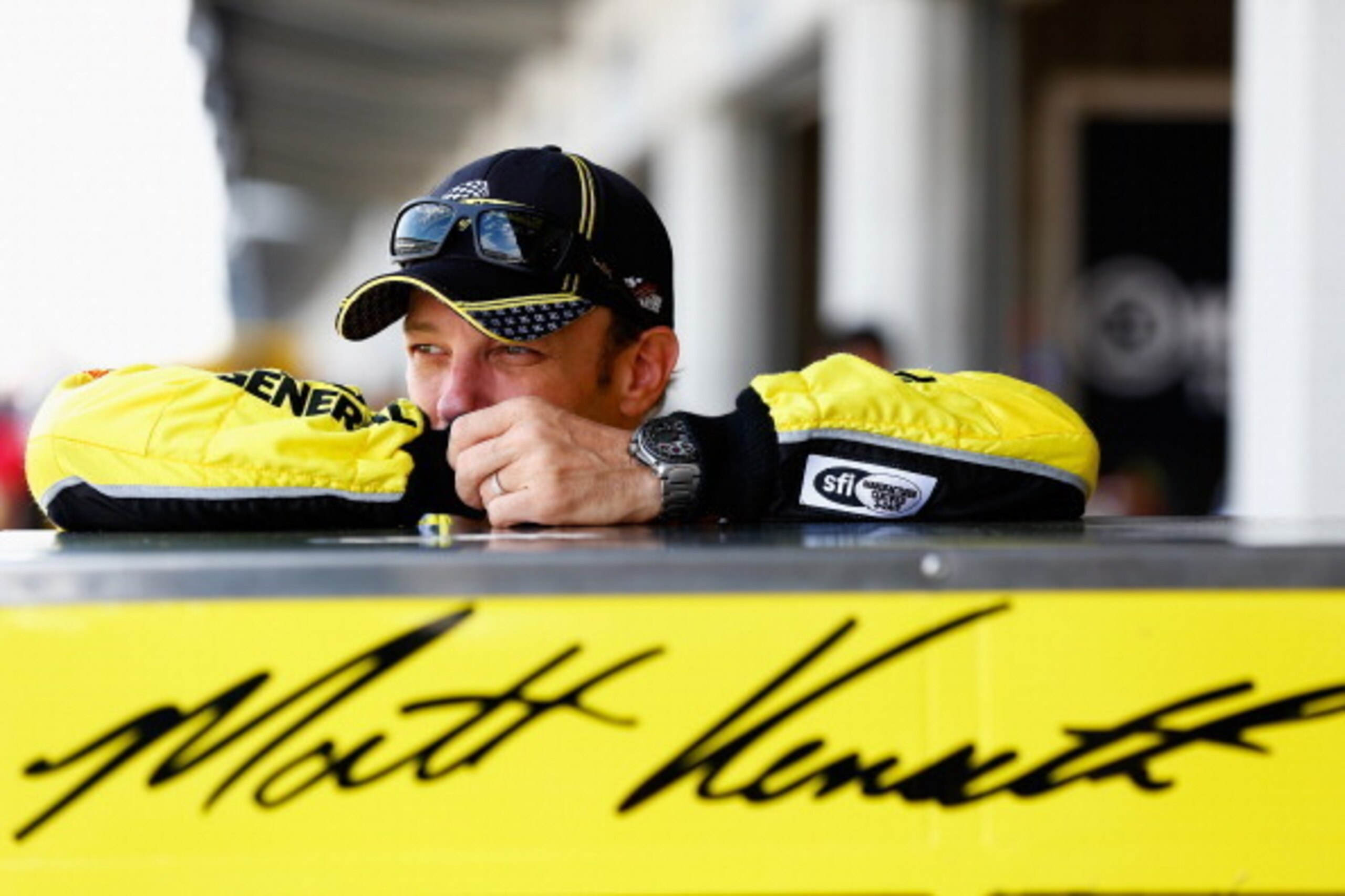 INDIANAPOLIS, IN - JULY 26:  Matt Kenseth, driver of the #20 Dollar General Toyota, looks on in the garage area during practice for the NASCAR Sprint Cup Series Crown Royal Presents The John Wayne Walding 400 at the Brickyard Indianapolis Motor Speedway o