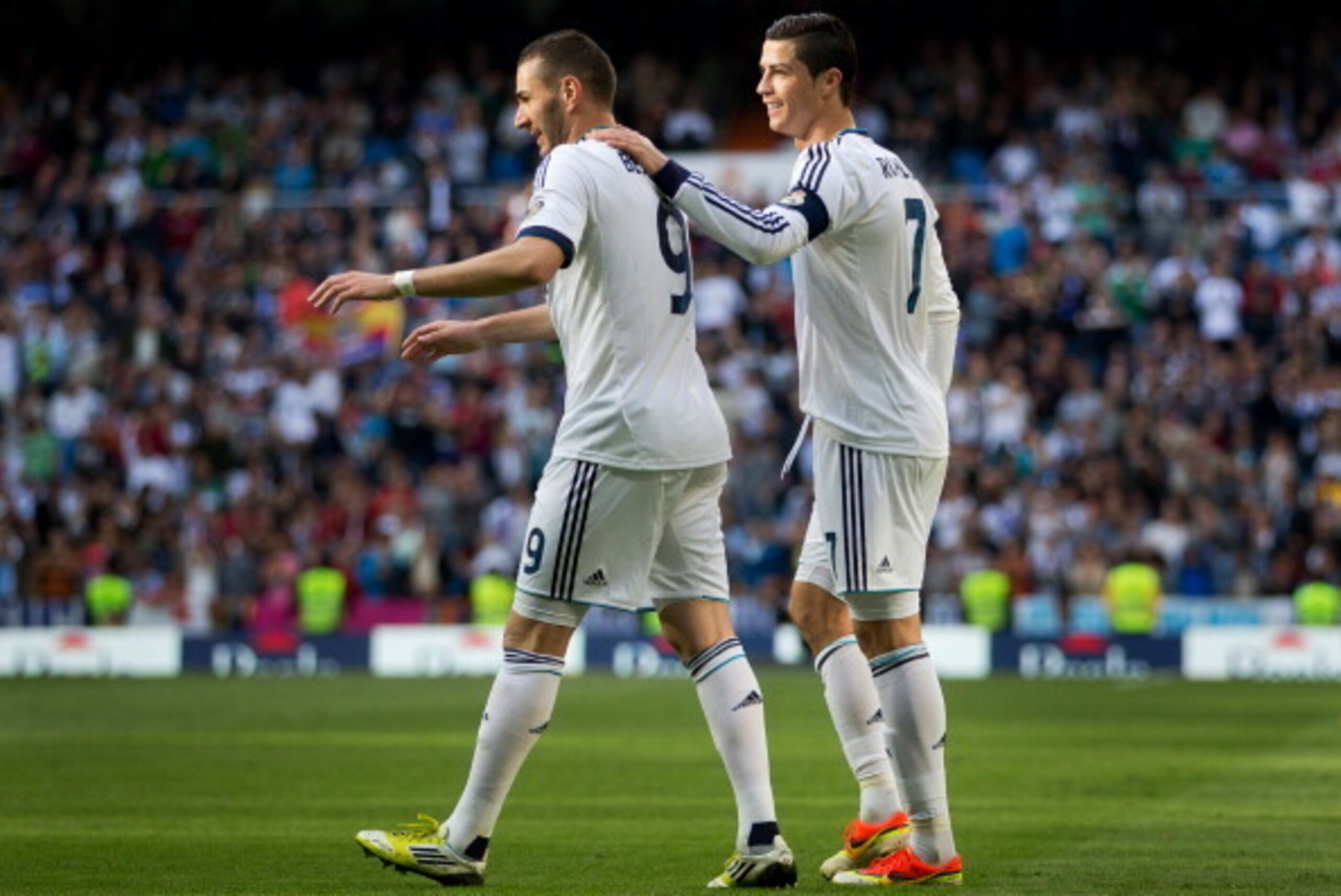 MADRID, SPAIN - APRIL 20:  Cristiano Ronaldo (R) of Real Madrid celebrates with Karim Benzema scoring his sides second goal during the la Liga match between Real Madrid CF and Real Betis Balompie at Estadio Santiago Bernabeu on April 20, 2013 in Madrid, S
