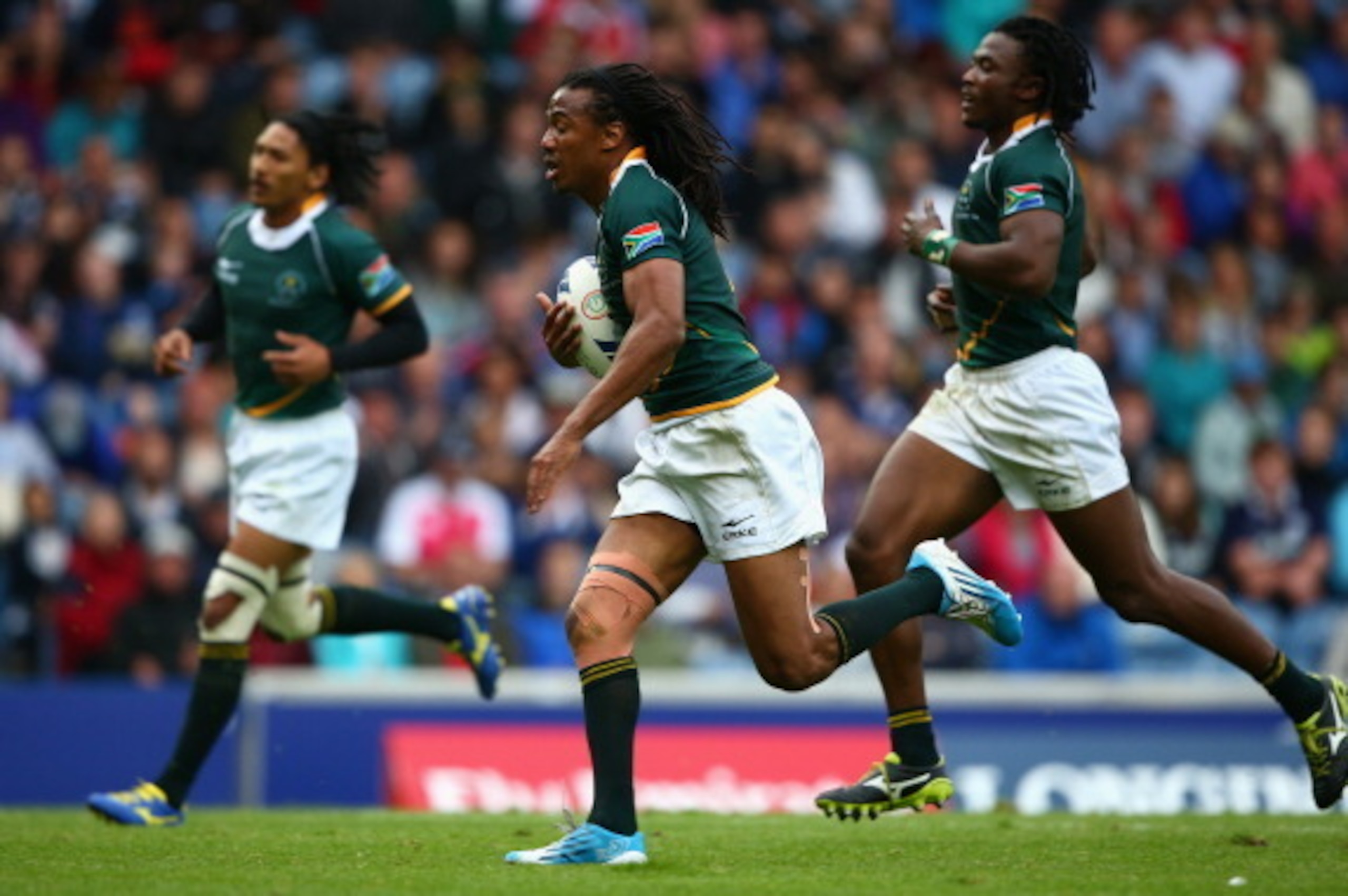 GLASGOW, SCOTLAND - JULY 27:  Cecil Afrika of South Africa runs clear to score a try in the semi final match between South Africa and Samoa during the Rugby Sevens at Ibrox Stadium during day four of the Glasgow 2014 Commonwealth Games on July 27, 2014 in